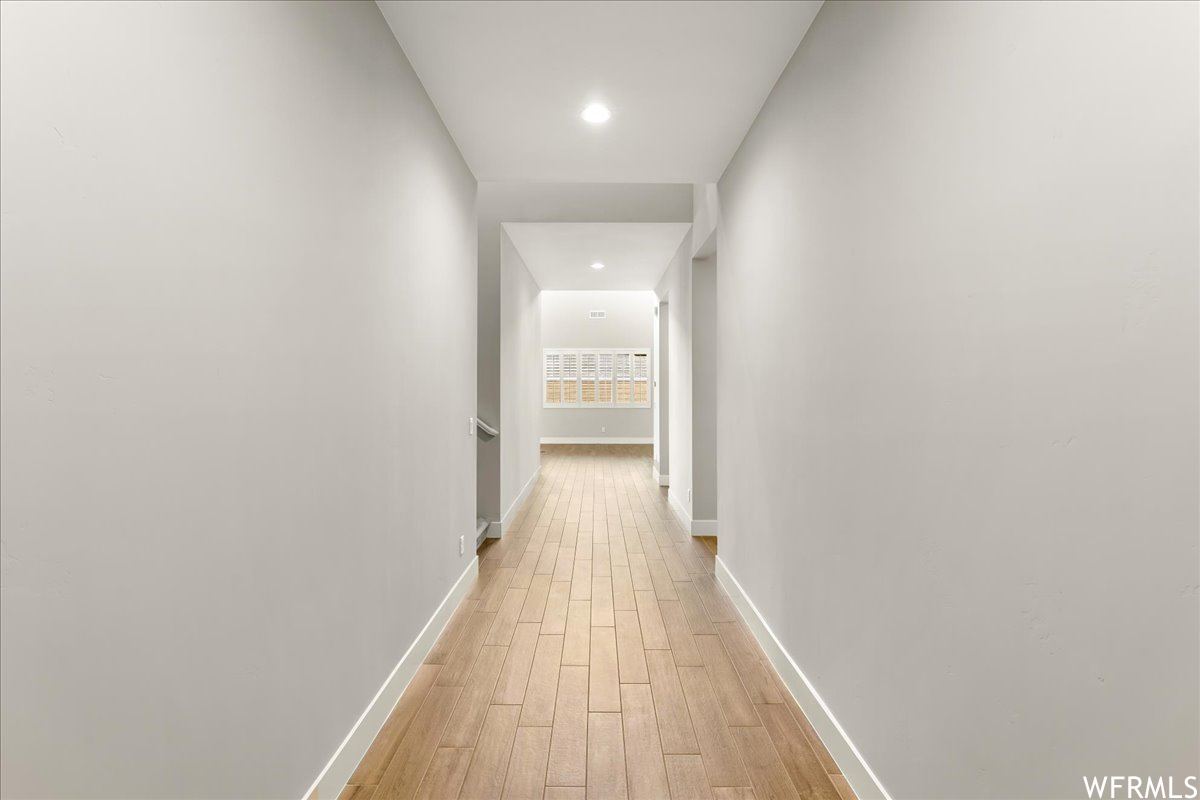 Hall with light wood-type flooring