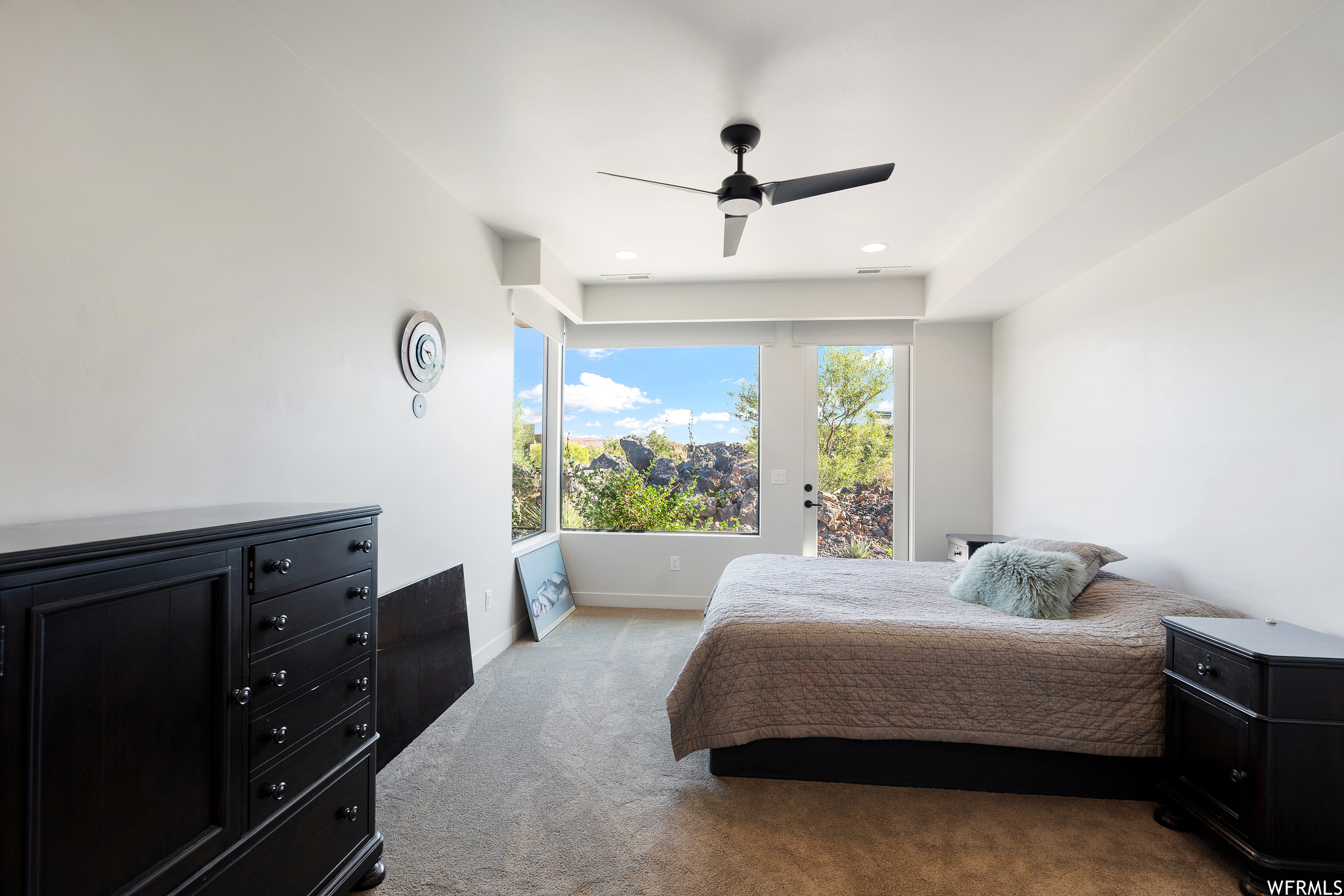 Bedroom featuring ceiling fan, light colored carpet, and access to outside