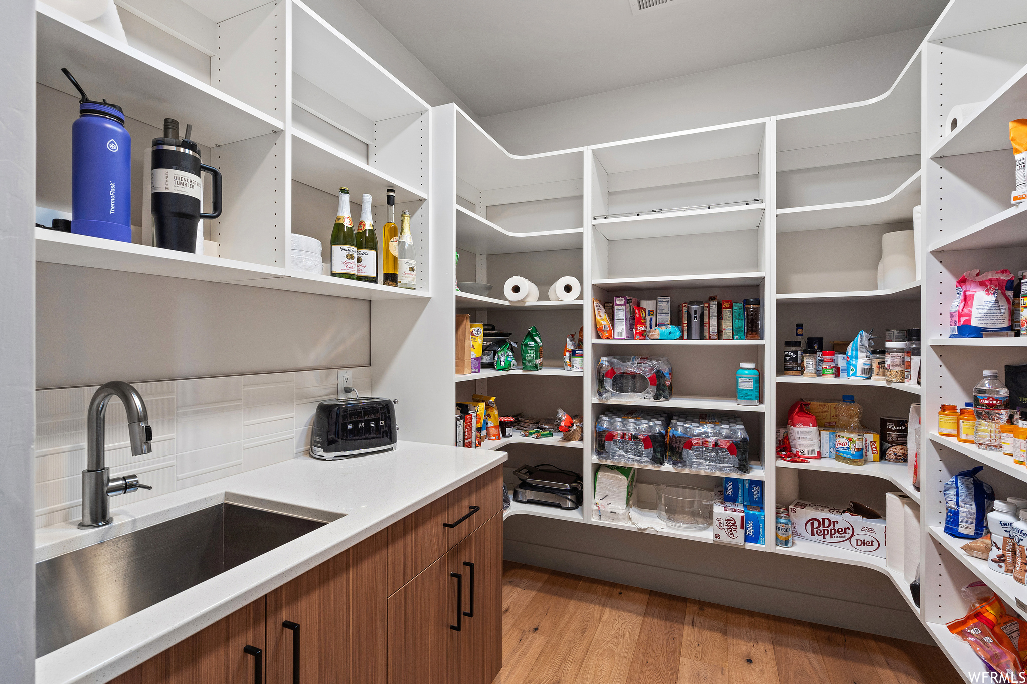 Pantry featuring sink