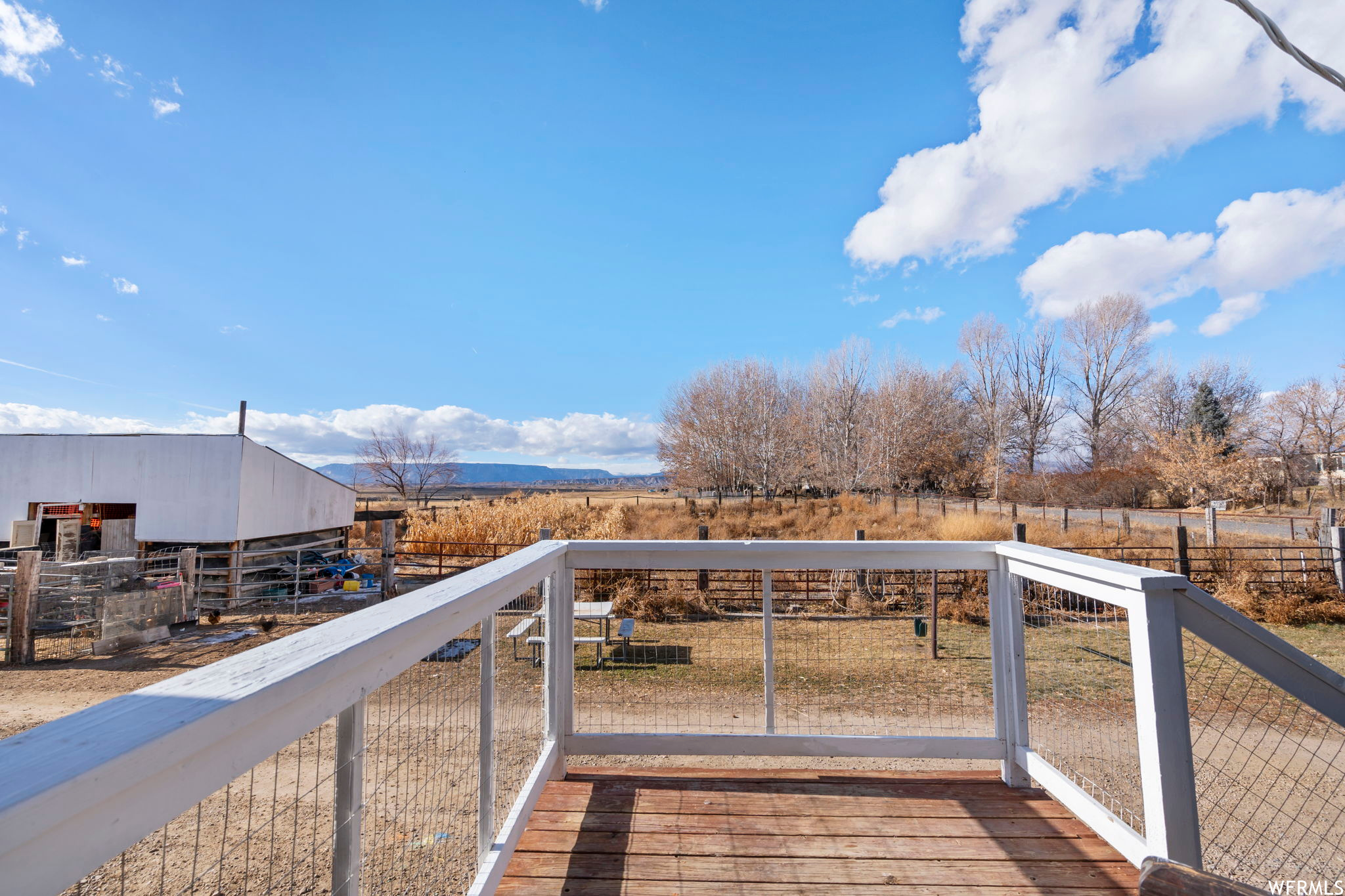 Wooden terrace featuring a rural view