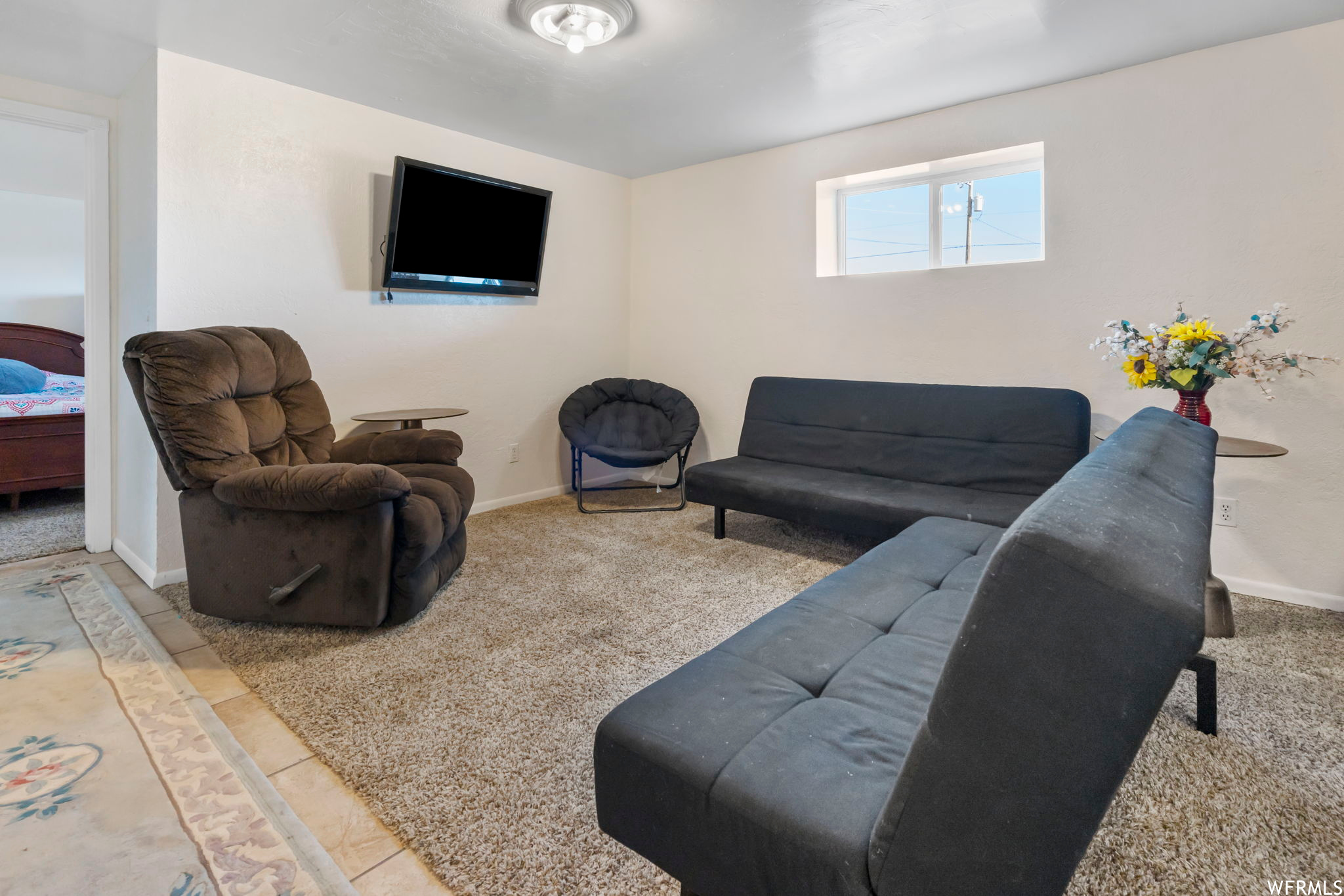 Living room with light tile floors