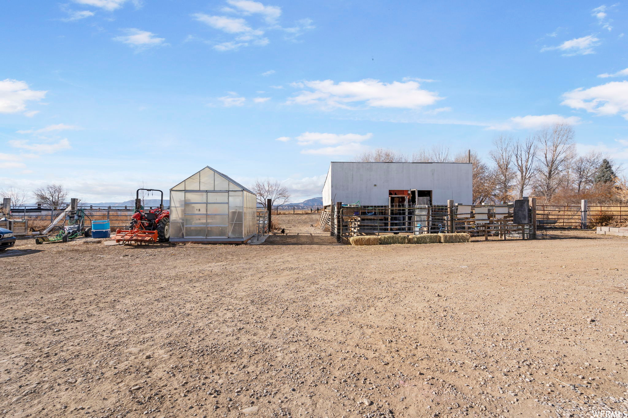 View of yard featuring an outdoor structure and a rural view