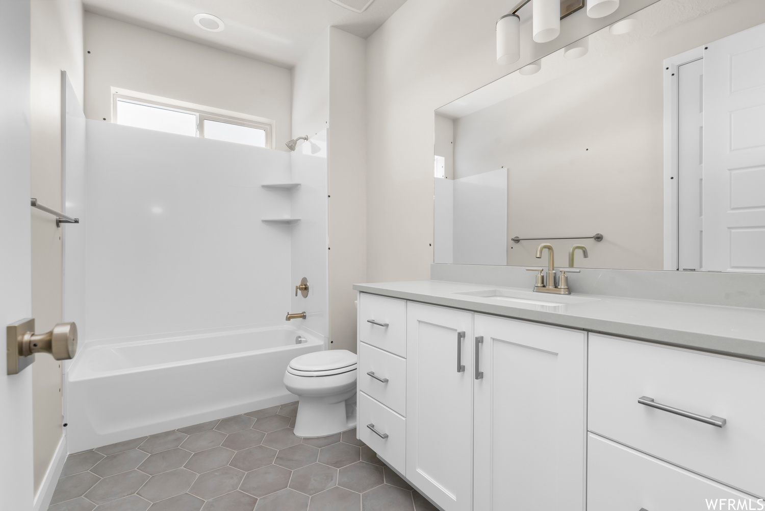 Full bathroom with toilet, tile flooring, bathtub / shower combination, and oversized vanity