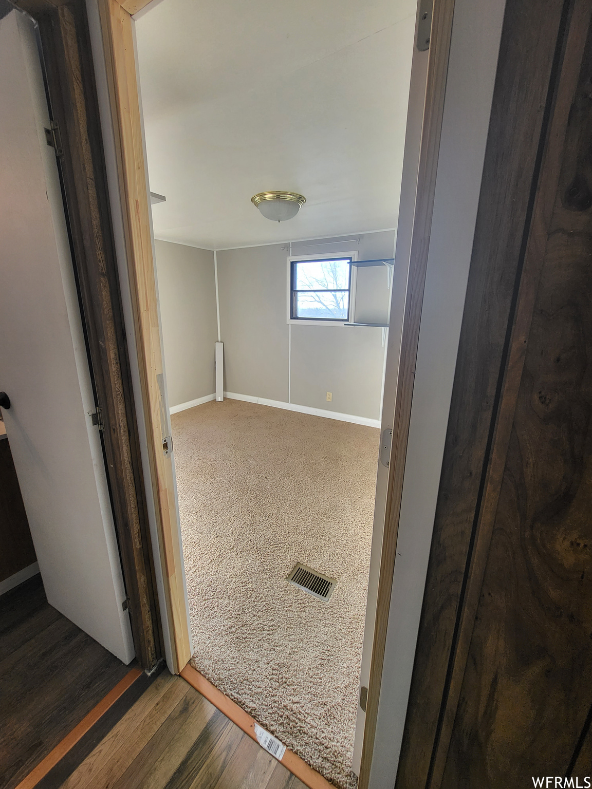 Bathroom with hardwood / wood-style flooring