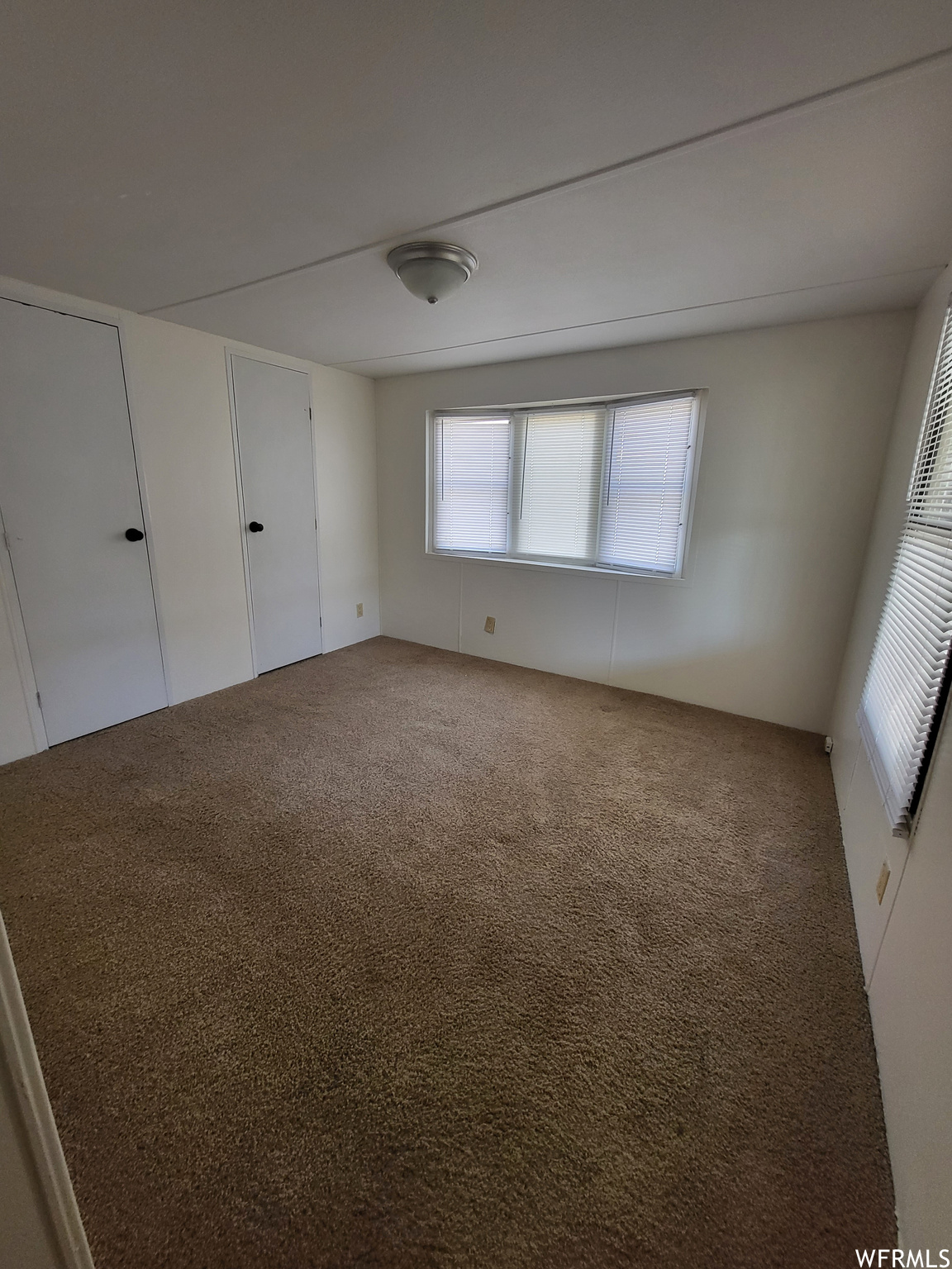 Spare room with carpet floors