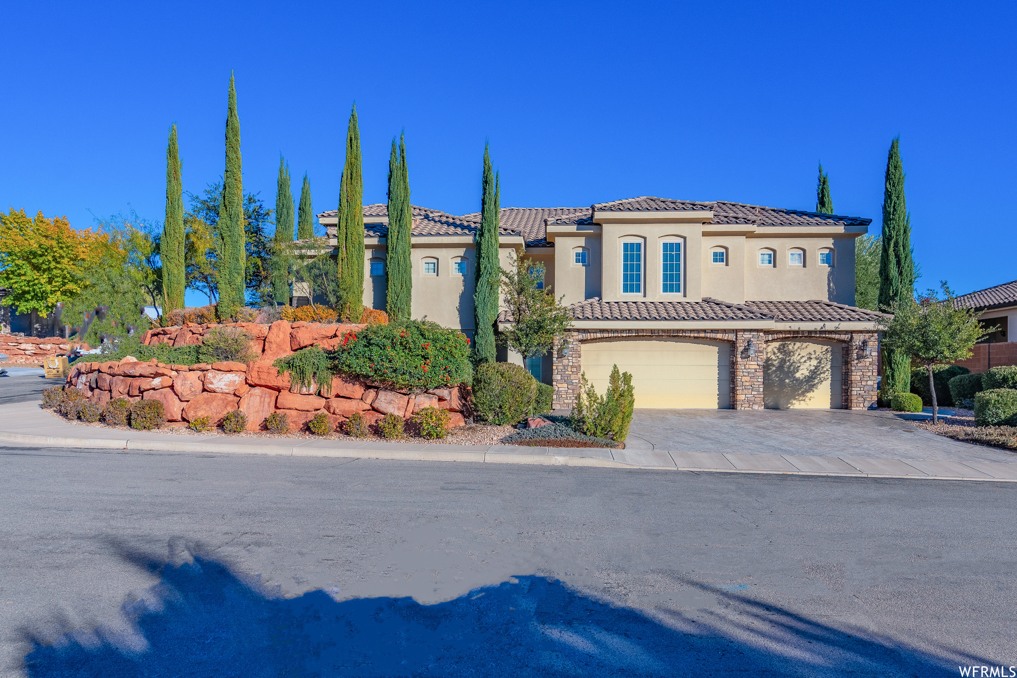 Mediterranean / spanish home featuring a garage