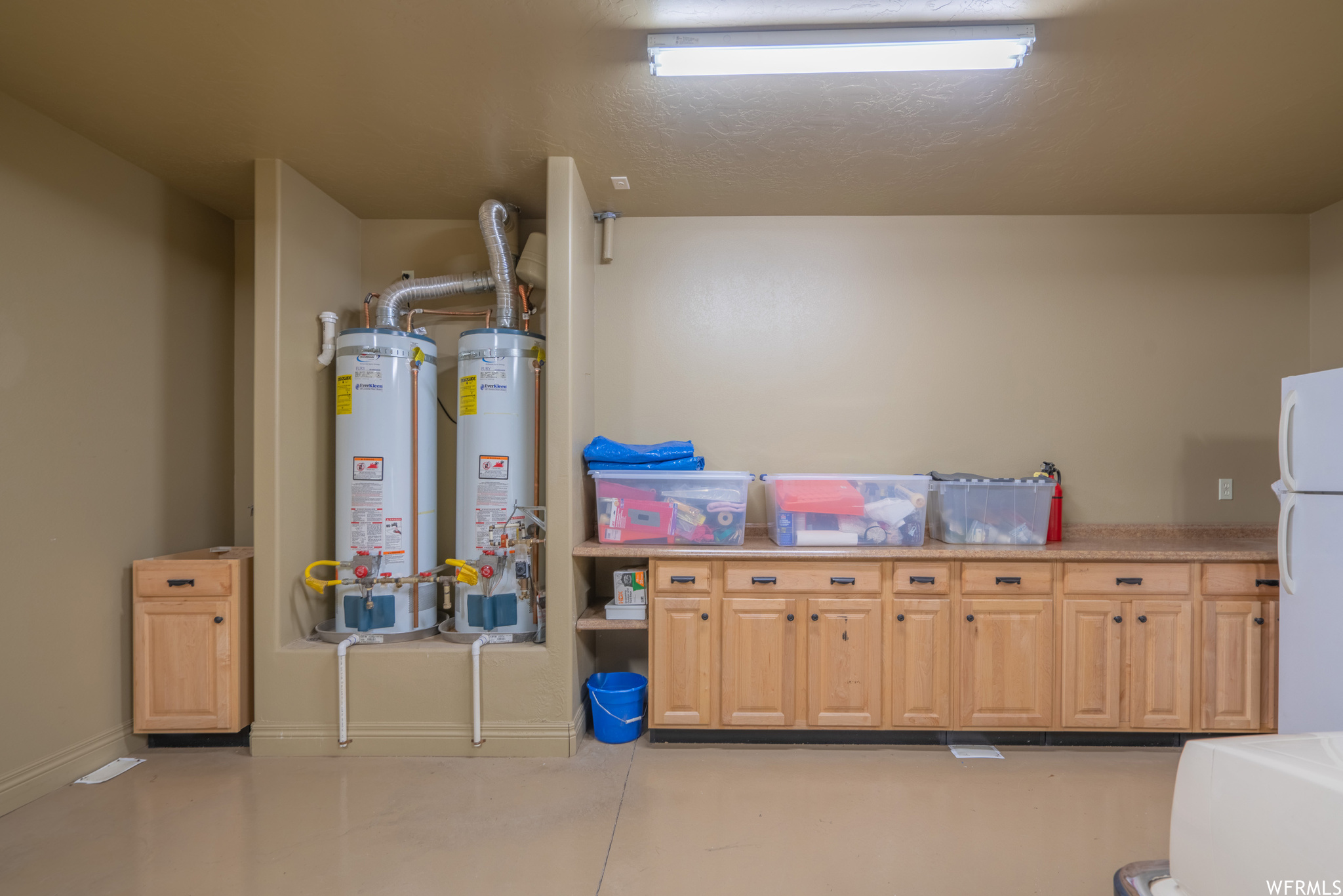 Utility room featuring gas water heater