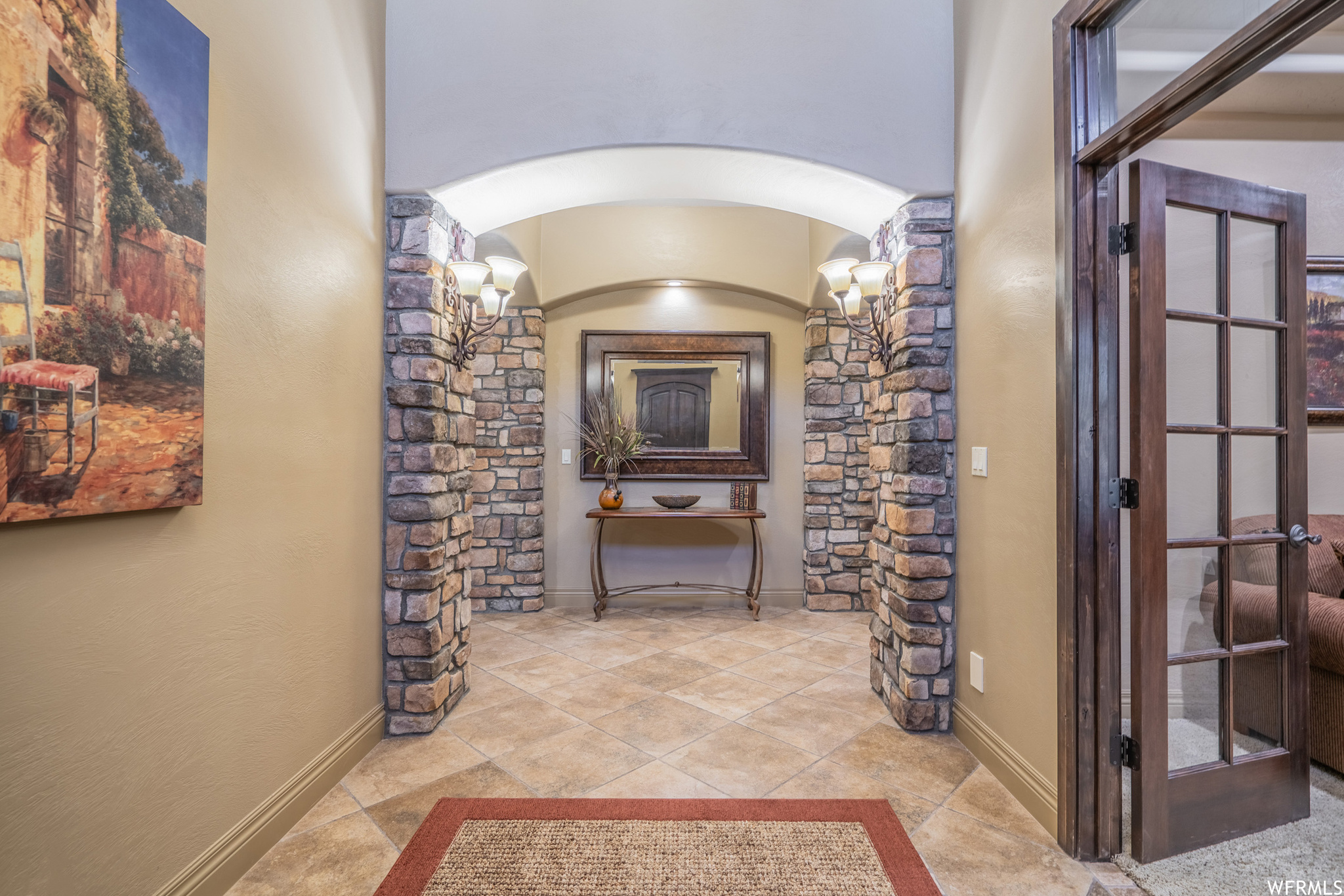 Interior space featuring light tile floors