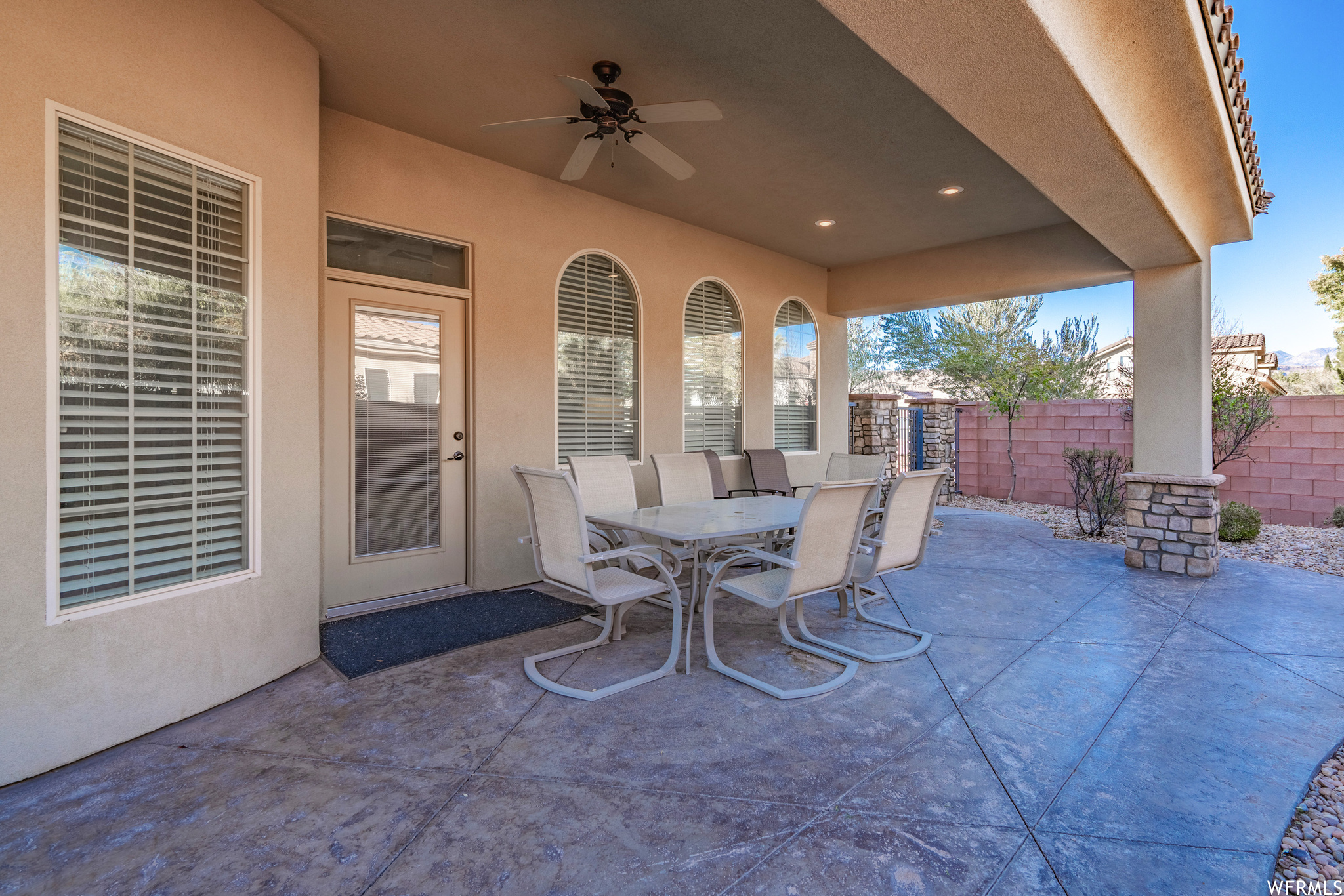 View of patio with ceiling fan