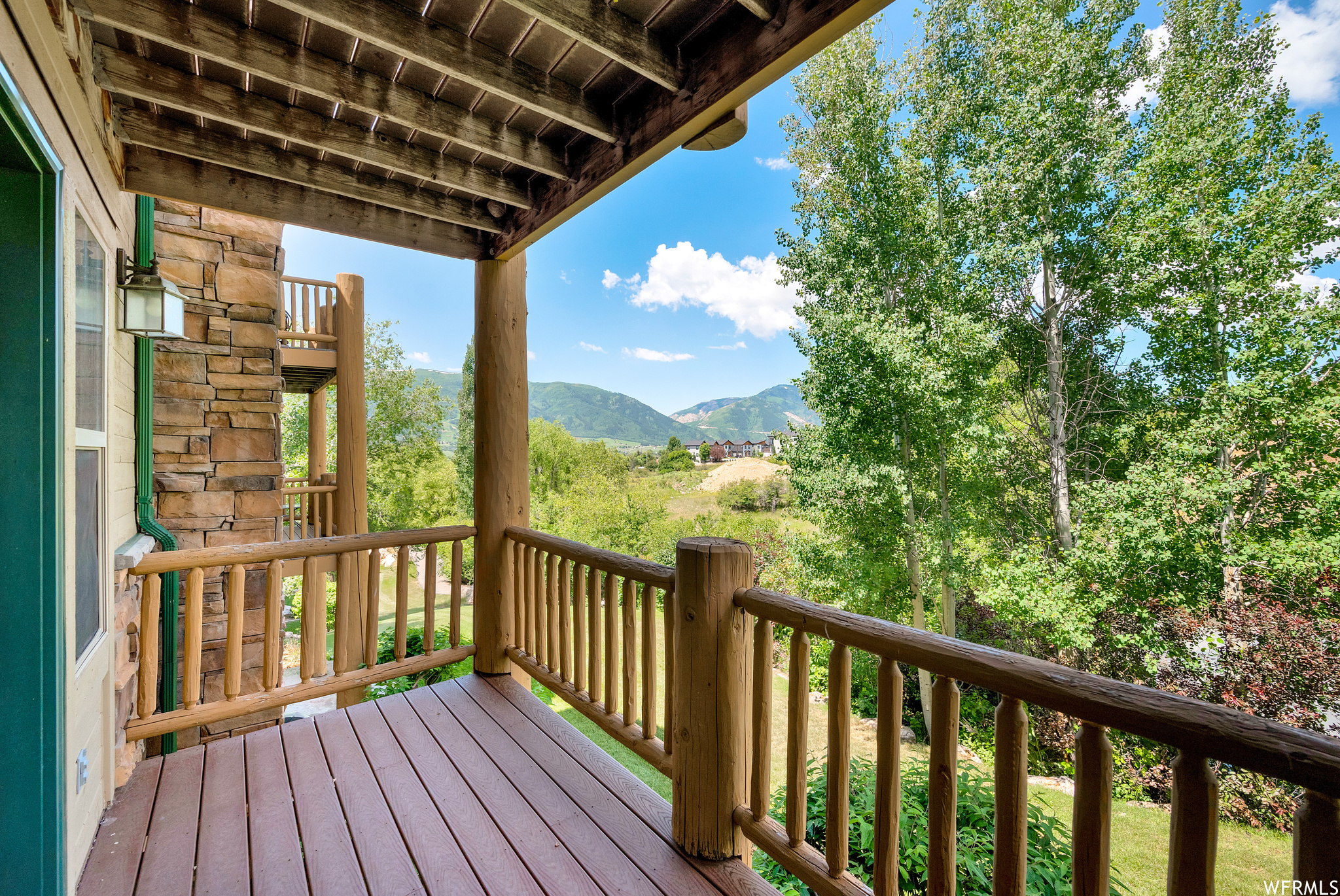 Exterior Balcony: Wooden deck with a mountain view
