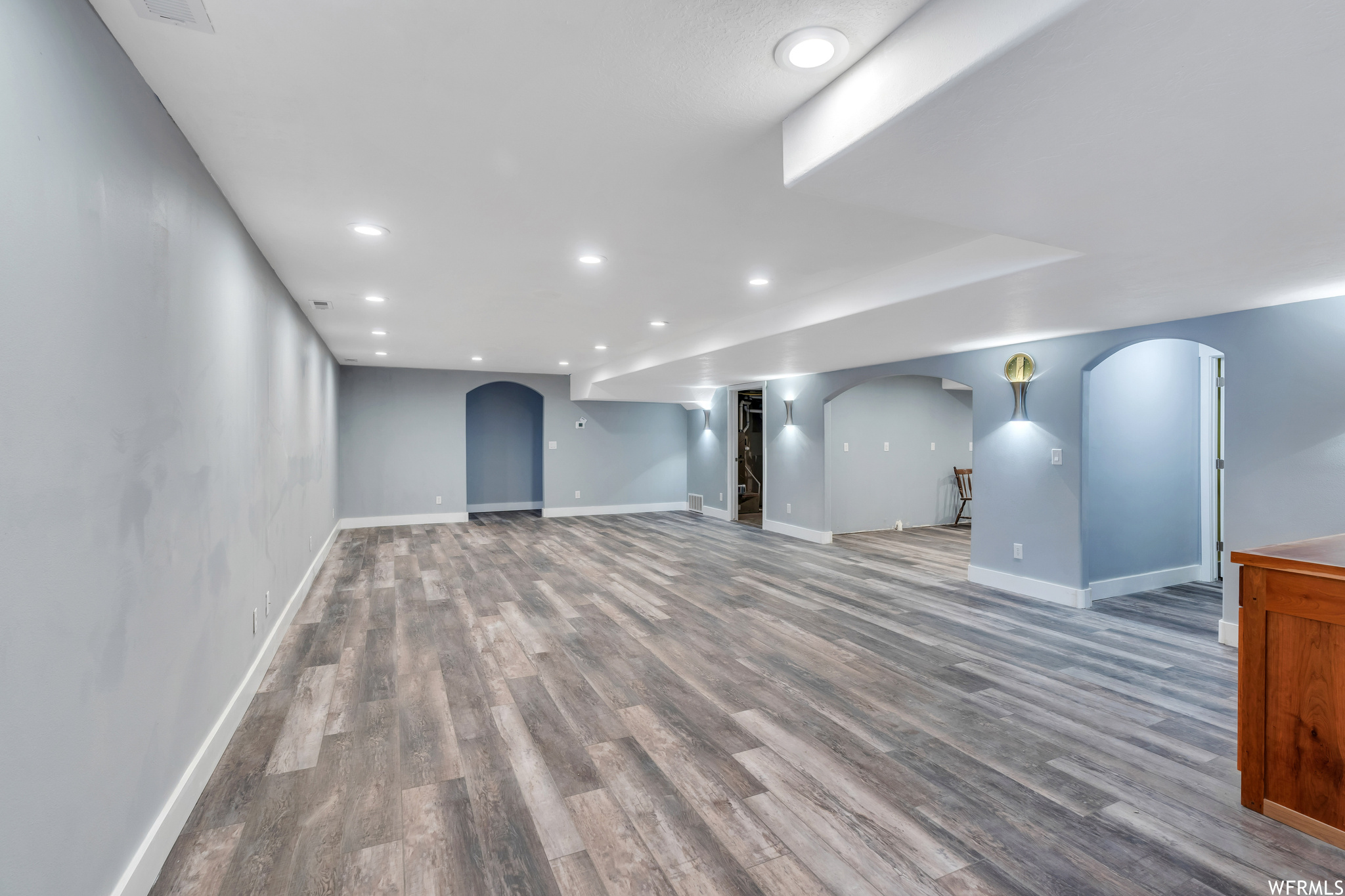 Basement featuring hardwood / wood-style floors