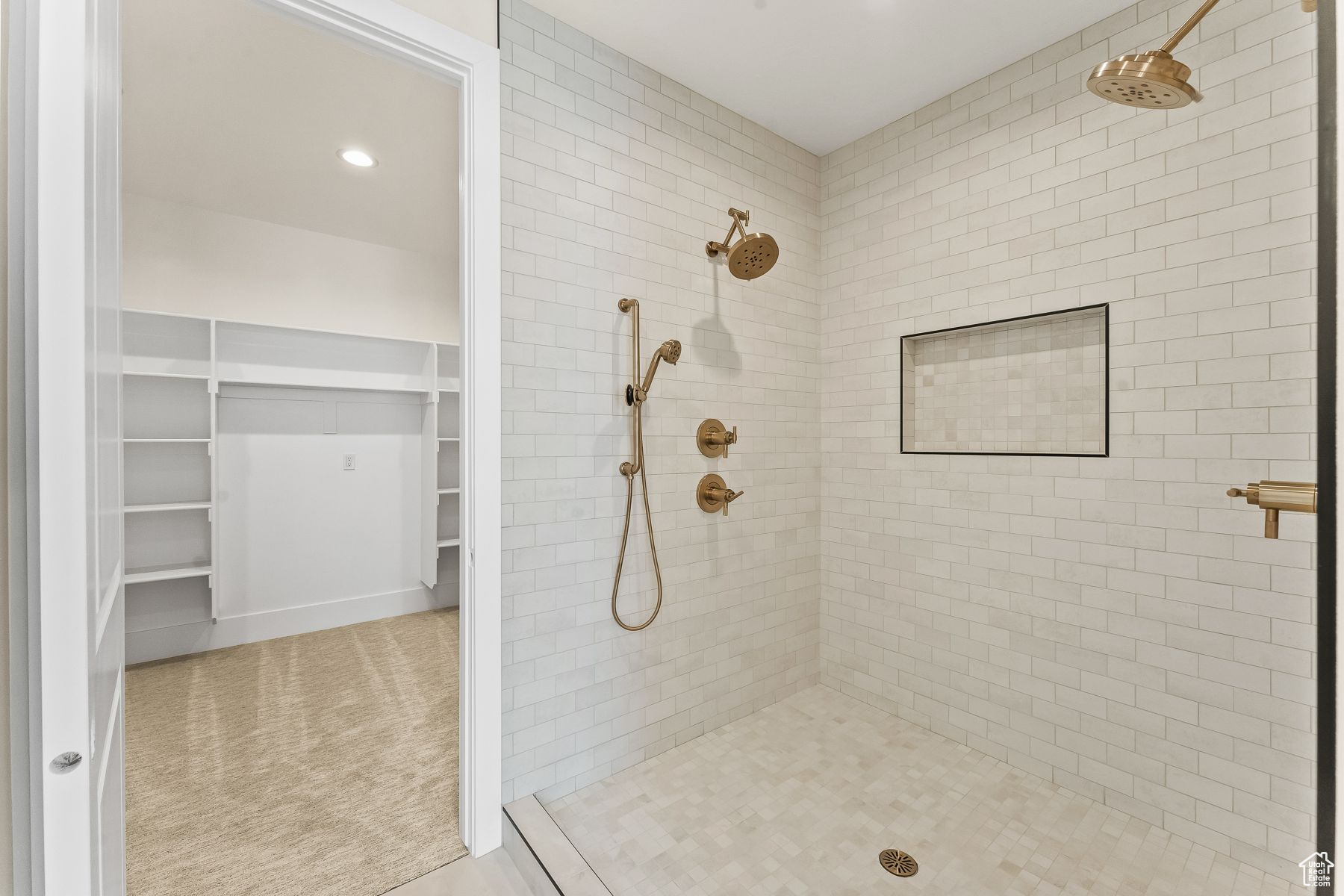 Bathroom featuring a tile shower