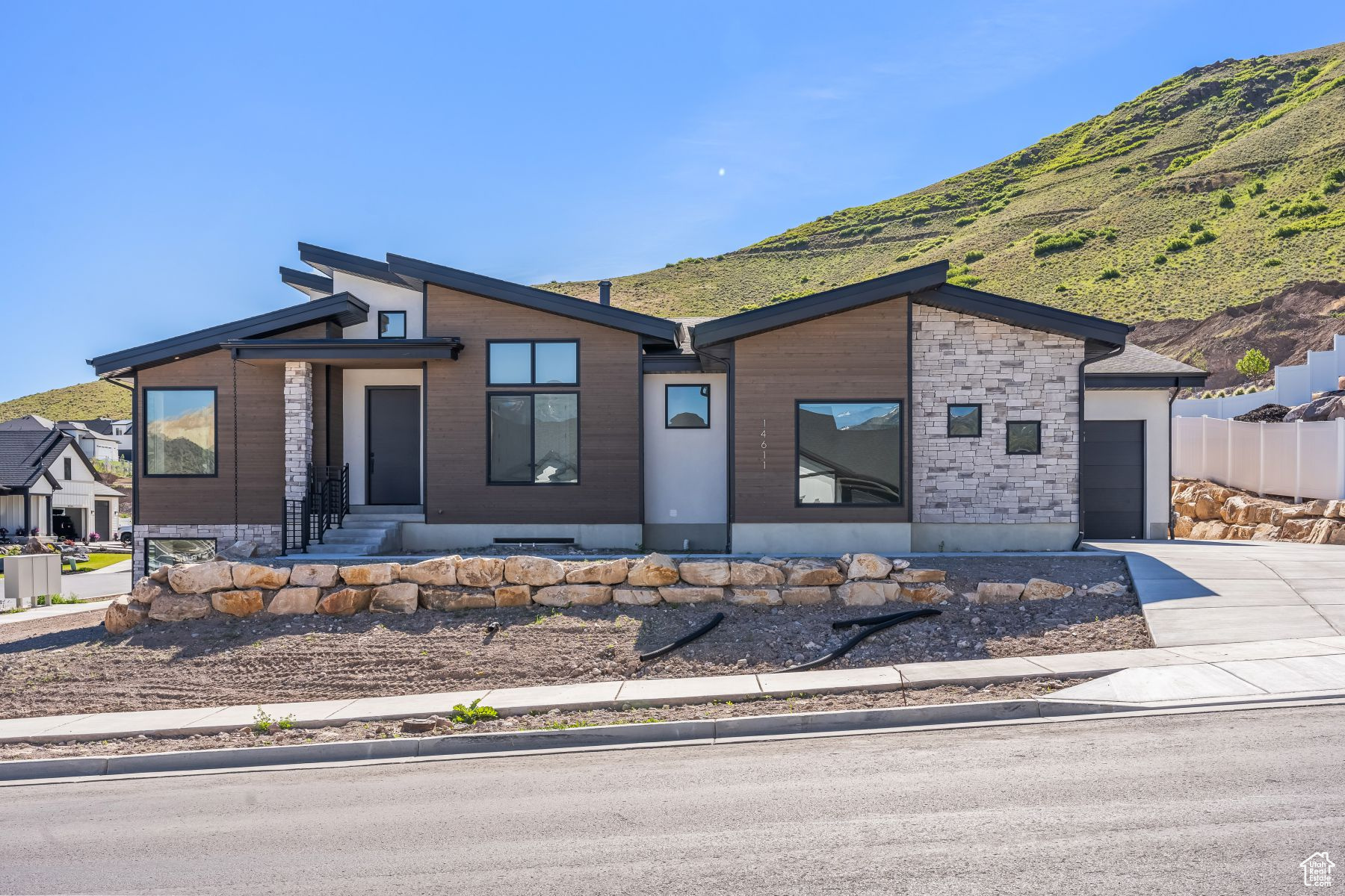 View of front of home featuring a garage and a mountain view