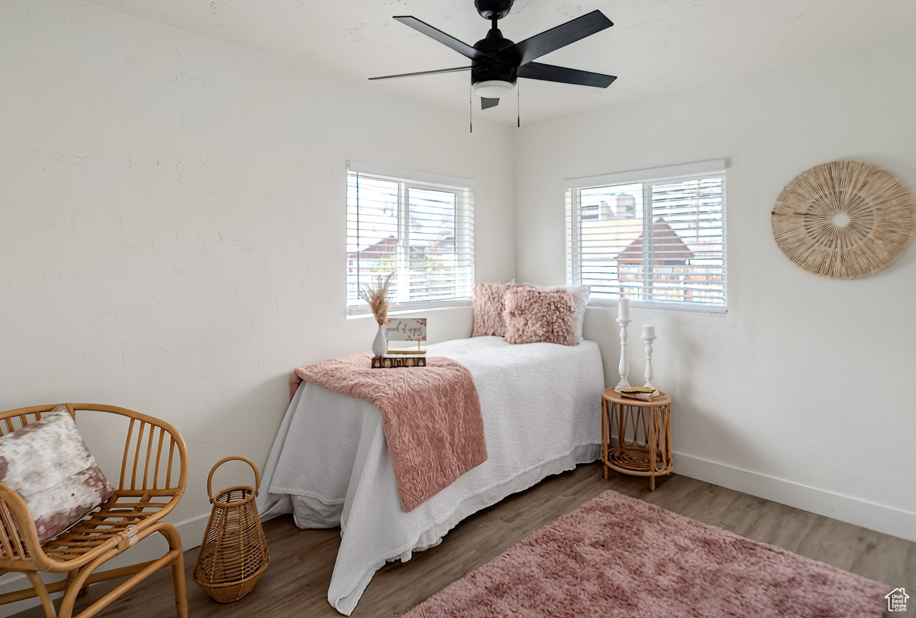 Bedroom with ceiling fan and luxury vinyl flooring
