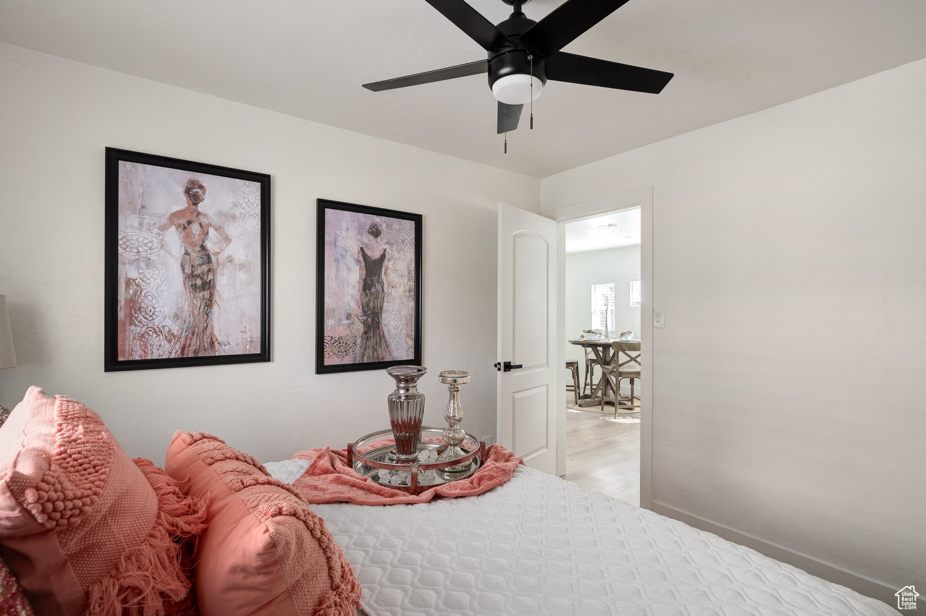 Bedroom featuring ceiling fan and luxury vinyl flooring