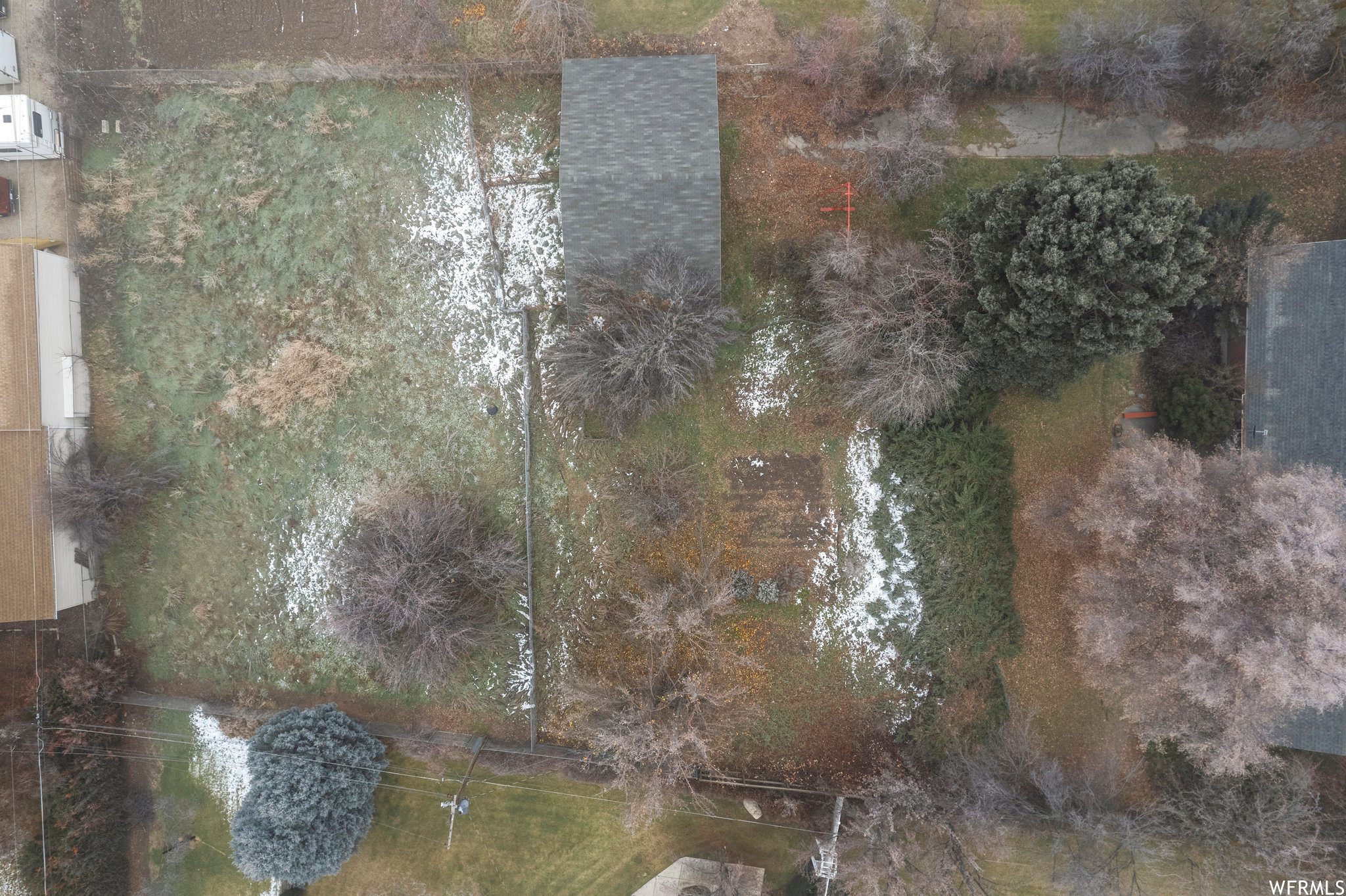 Pasture area on the left, Stable roof with Garden area in the middle, Backyard with trees to the right with edge of House roof.