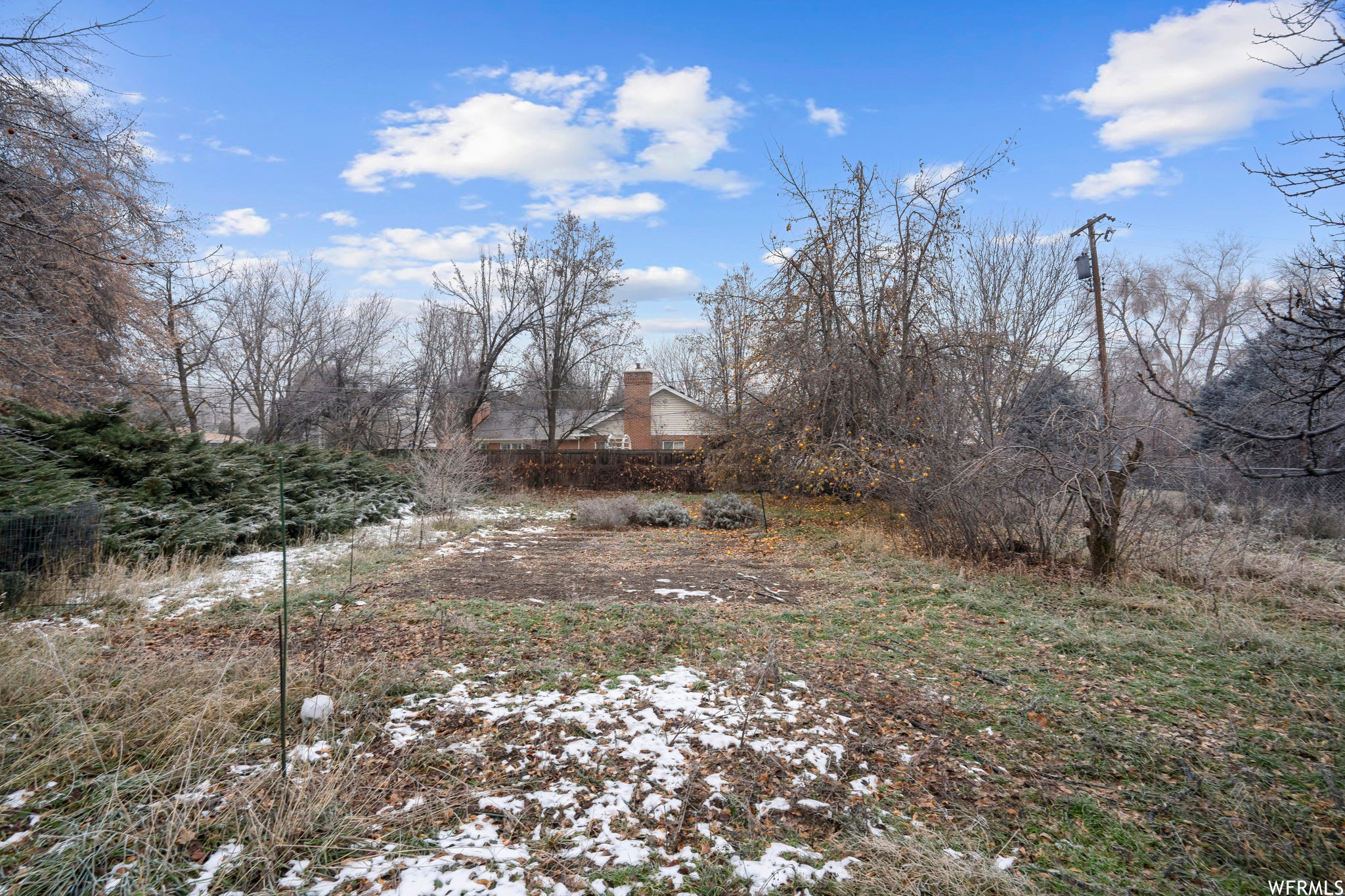 ground view of Garden area with fruit trees- E to W view, neighbors house in view.