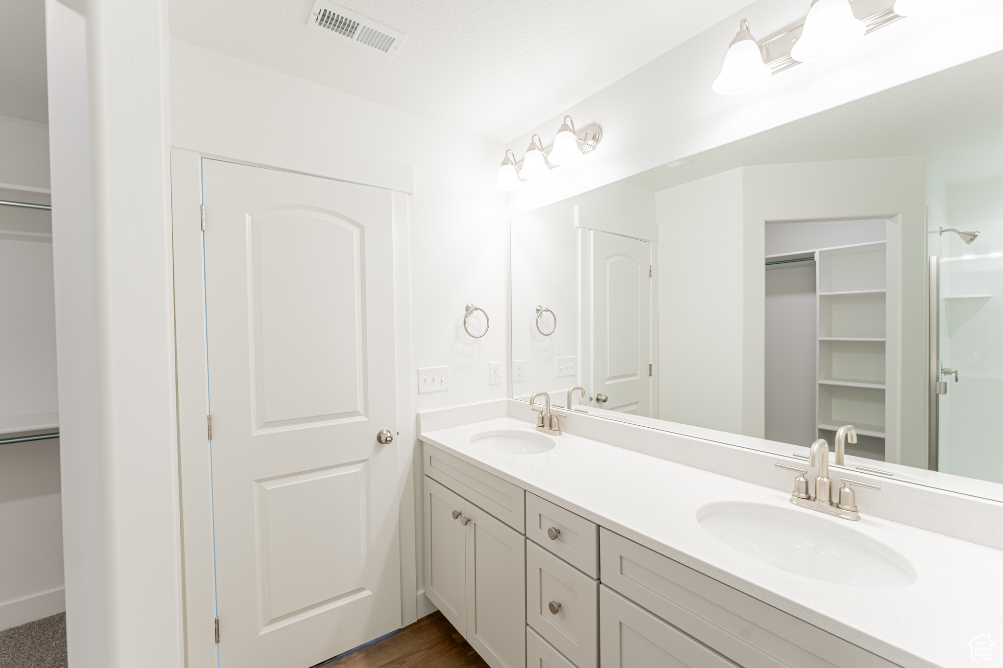 Bathroom featuring double sink and oversized vanity