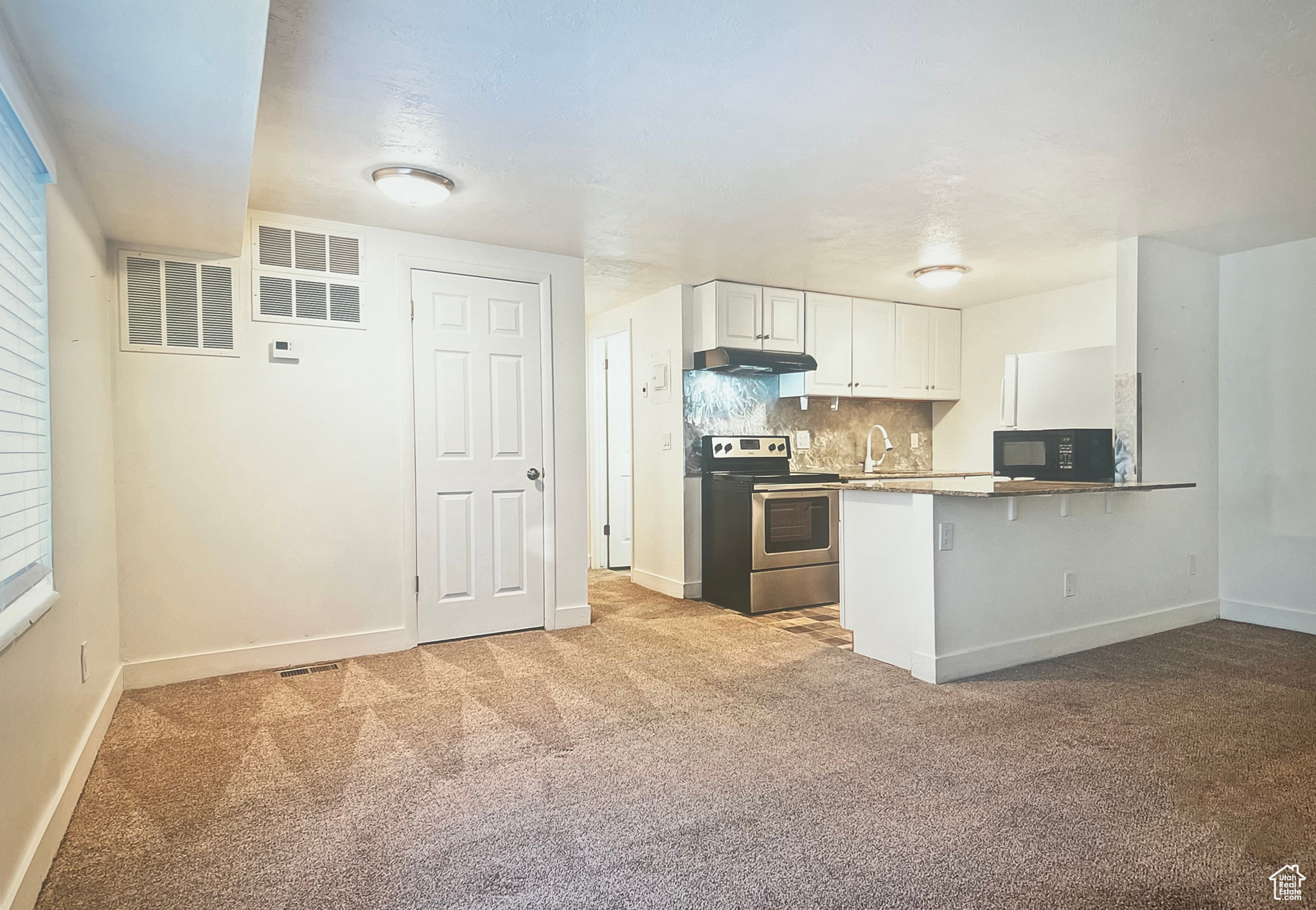 Spacious kitchen with laundry