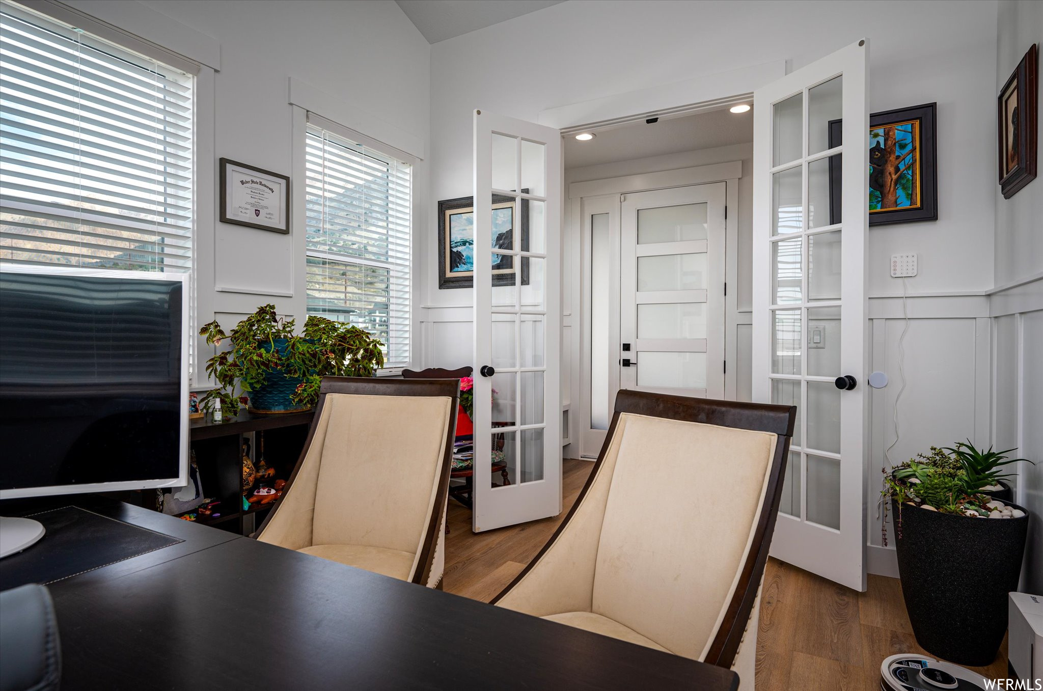 Office area featuring dark hardwood / wood-style flooring and french doors