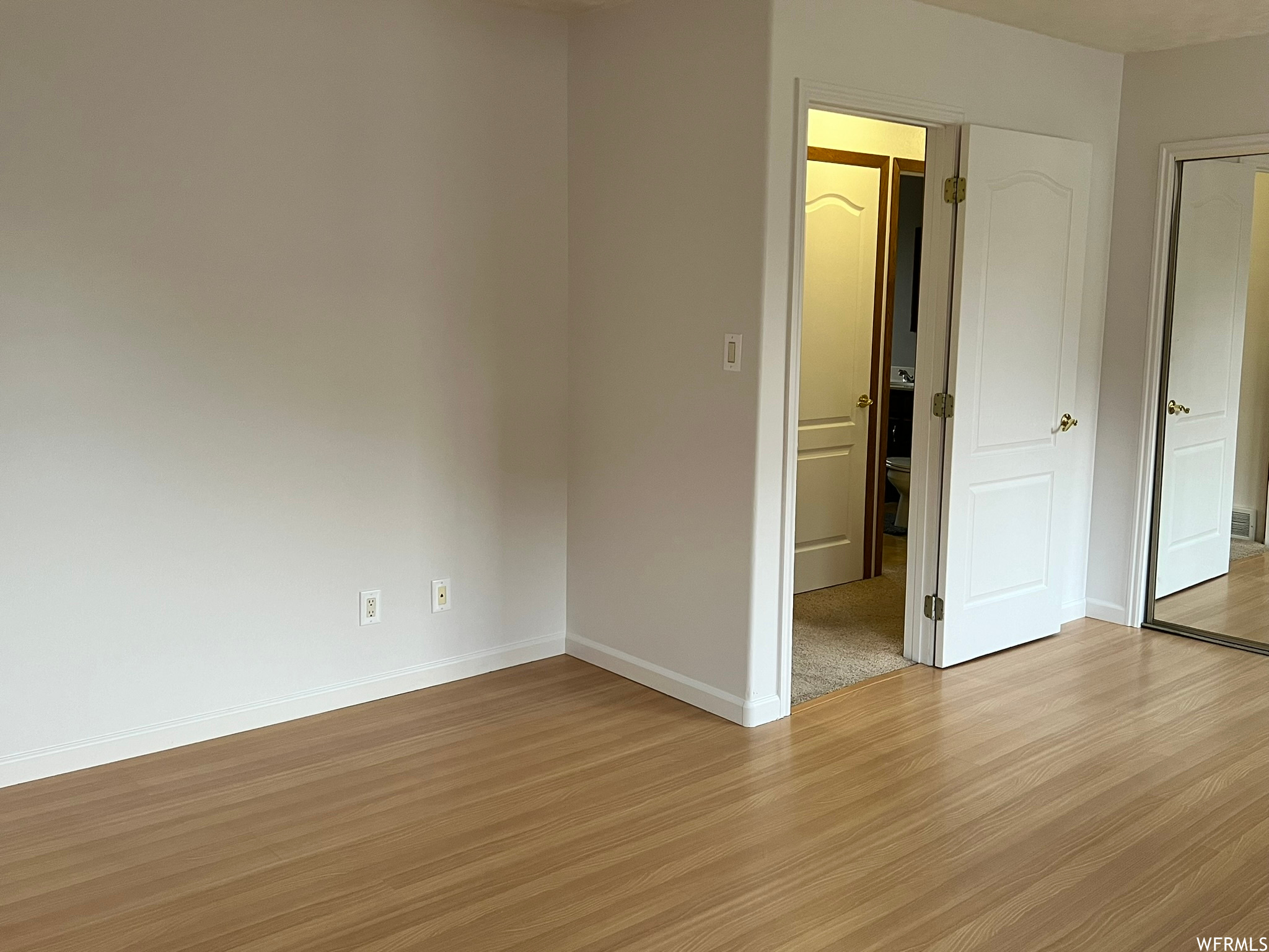 Unfurnished room featuring light hardwood/ wood-style floors