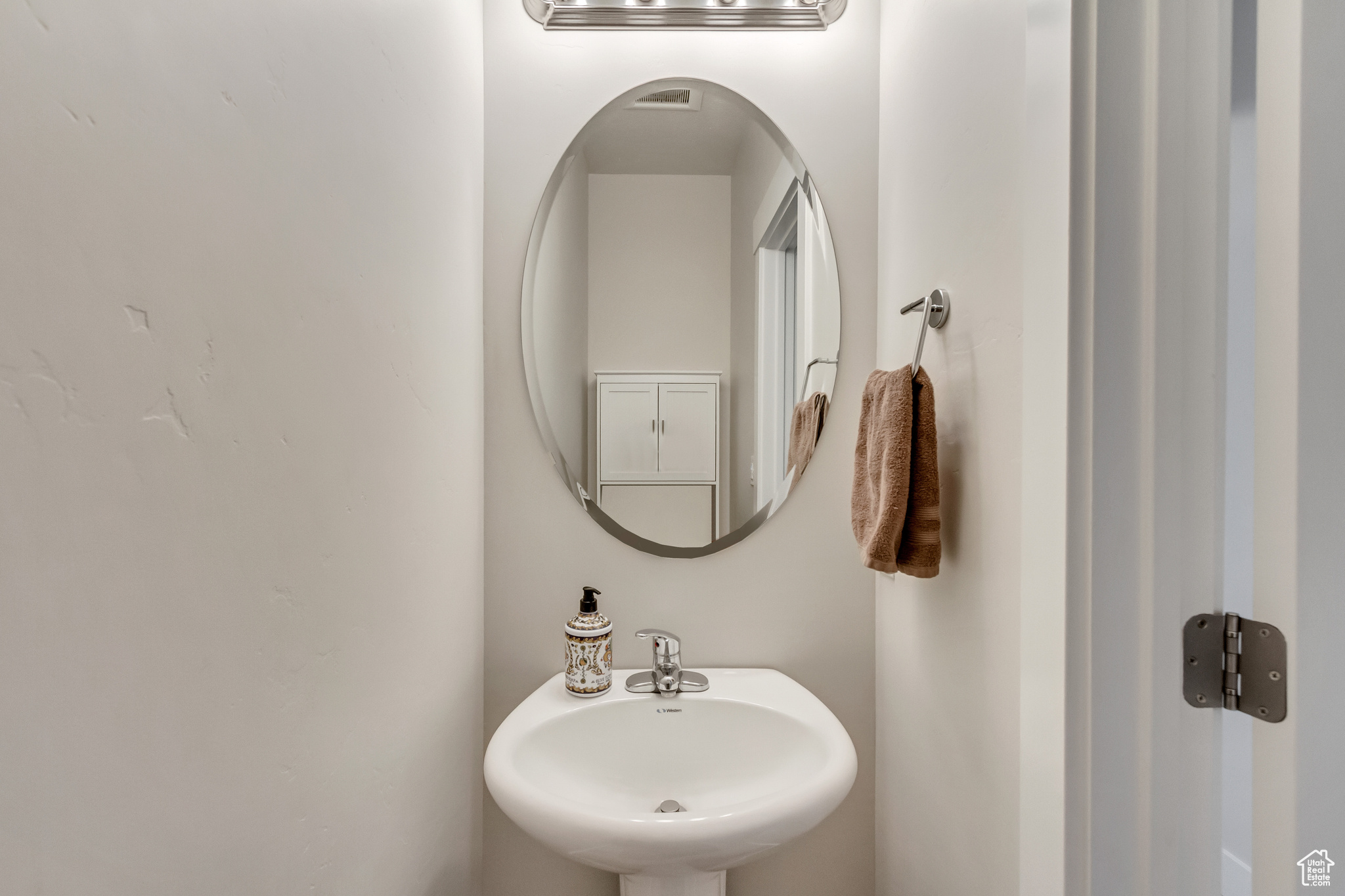 Half Bathroom featuring pedestal sink