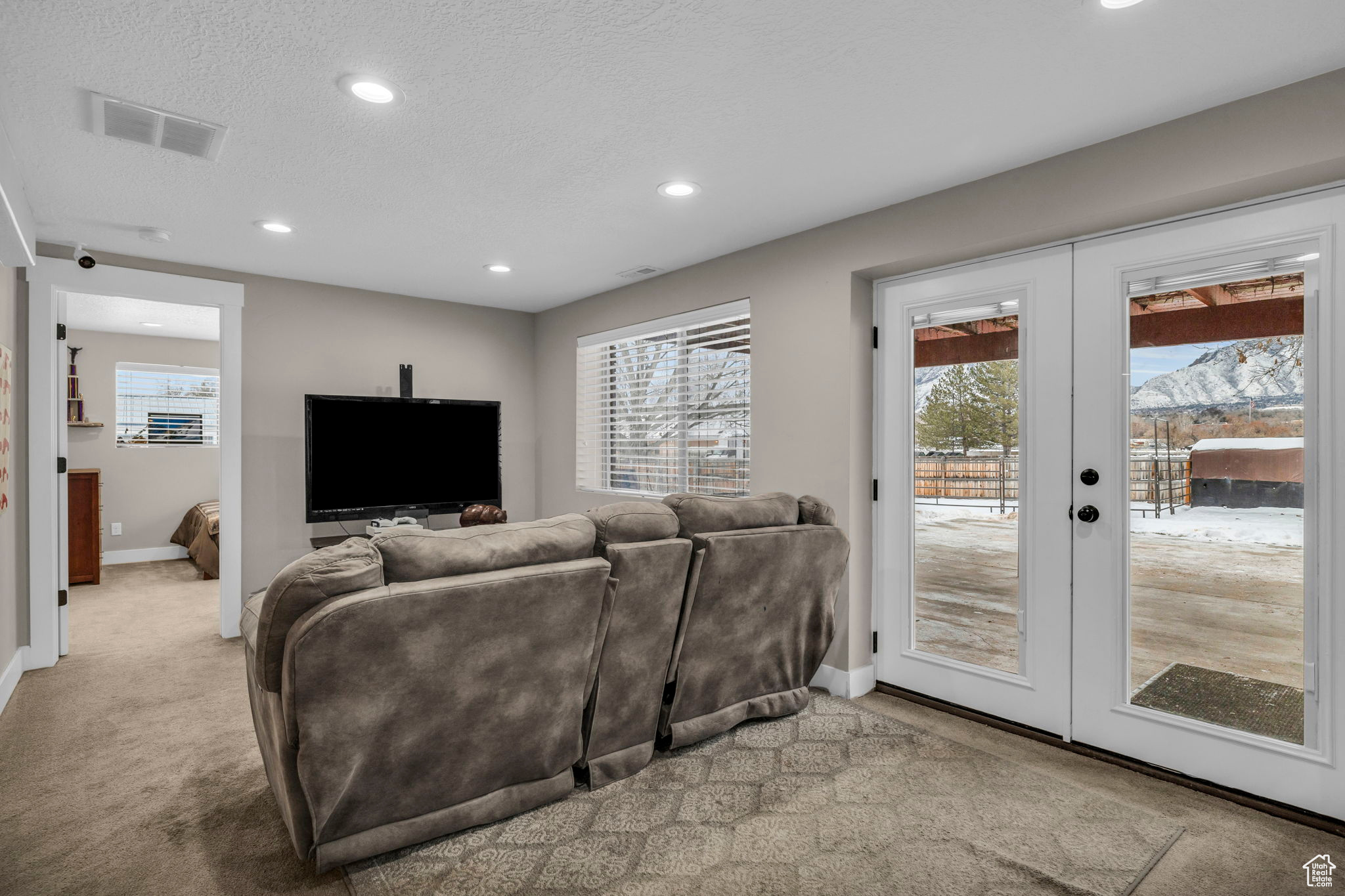 Ground level basement family room has covered patio access and natural light year round!