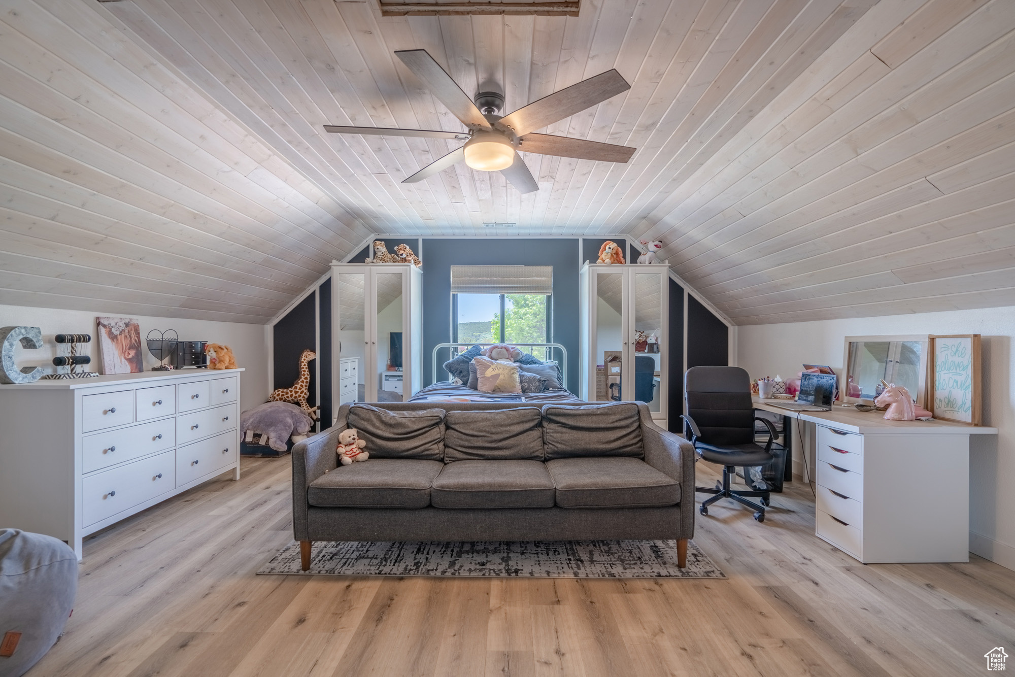 Bedroom featuring light hardwood / wood-style flooring, vaulted ceiling, wooden ceiling, and ceiling fan