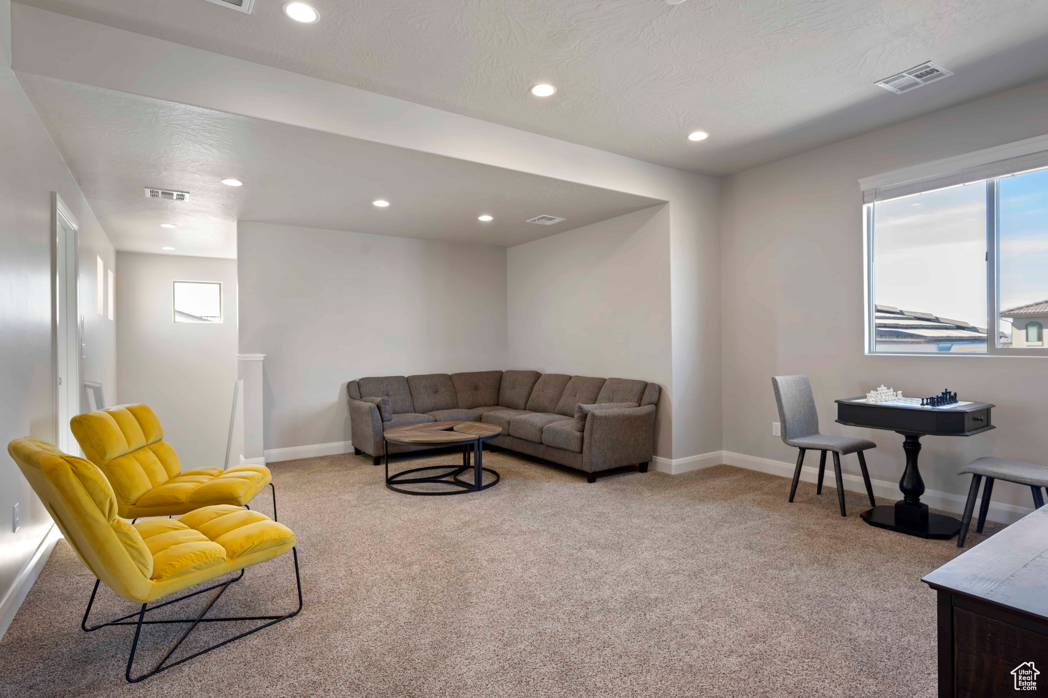 Living room with light colored carpet