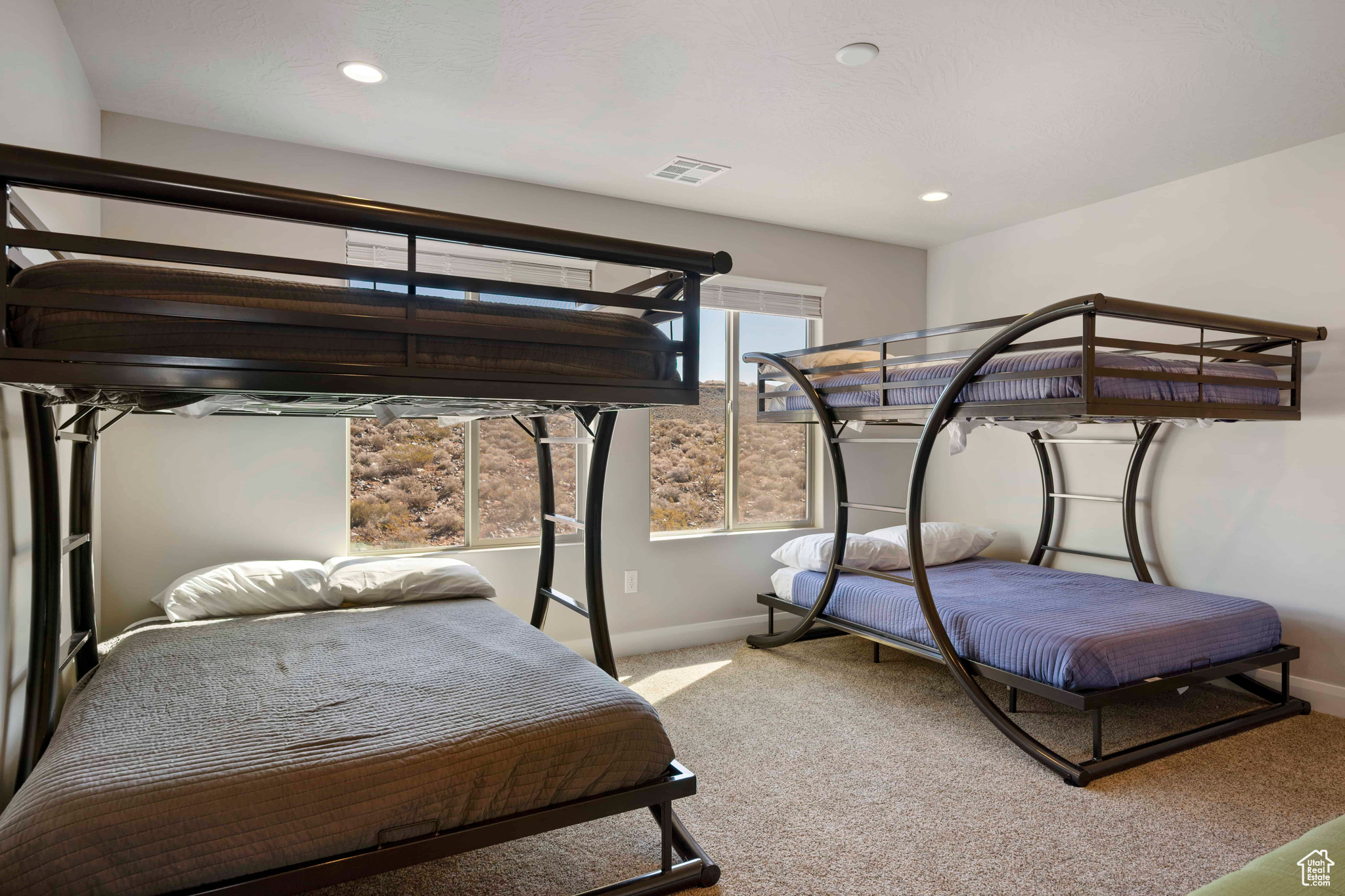 Bedroom with light colored carpet