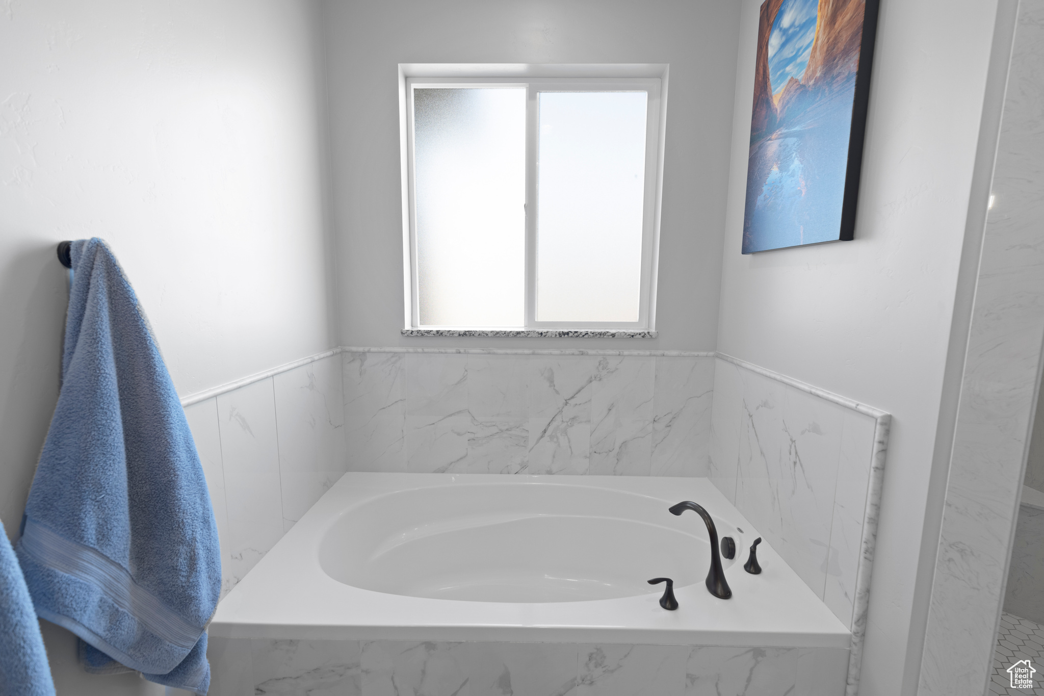 Bathroom with a relaxing tiled bath