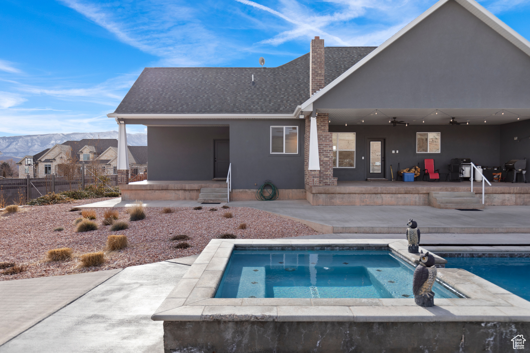 View of swimming pool featuring an in ground hot tub and a patio