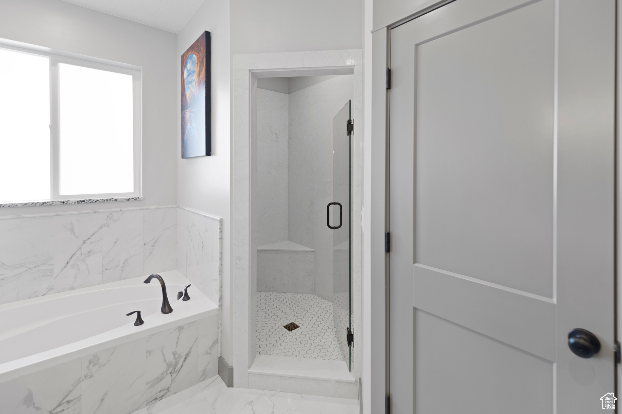 Bathroom featuring tile flooring and independent shower and bath