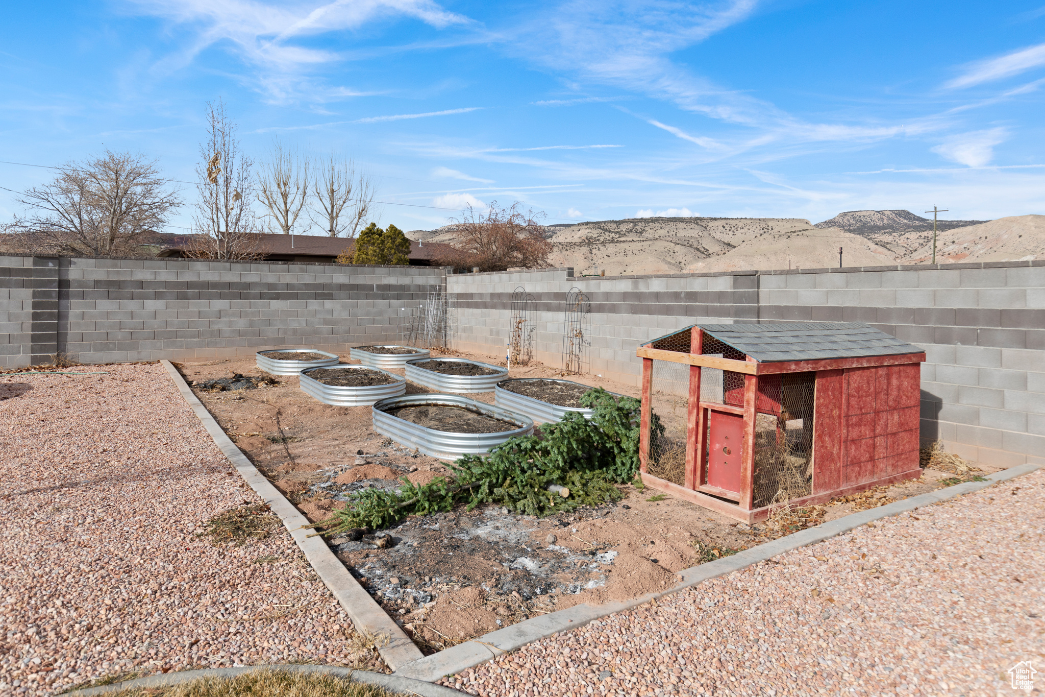 View of garden area featuring a chicken coop and a mountain view