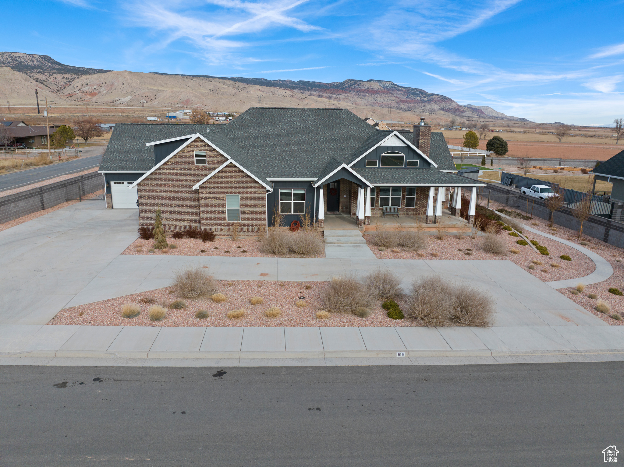 View of front of property featuring a garage and a mountain view