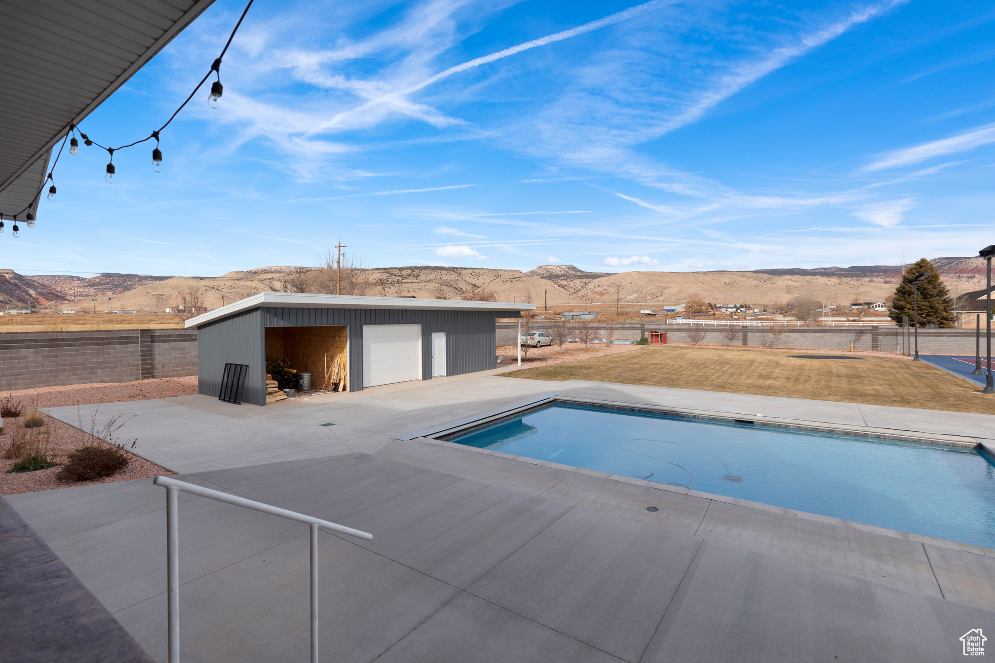 View of pool featuring a mountain view and a patio