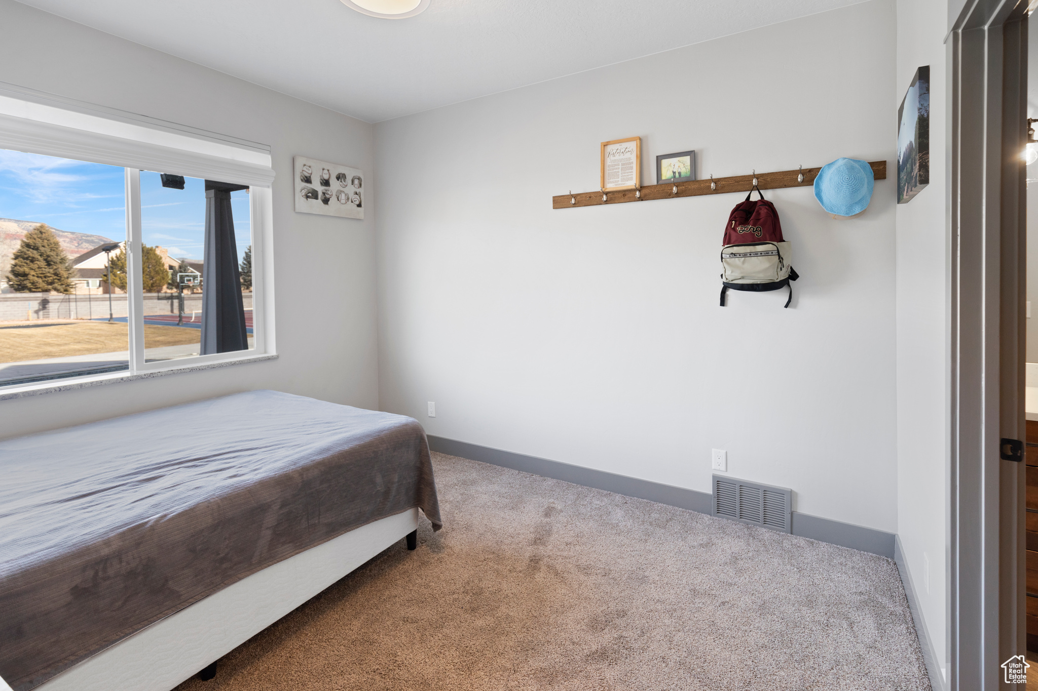 View of carpeted bedroom featuring connected bathroom