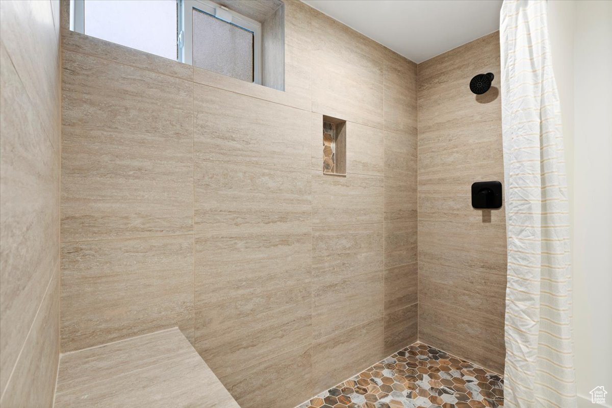 Bathroom featuring walk in shower