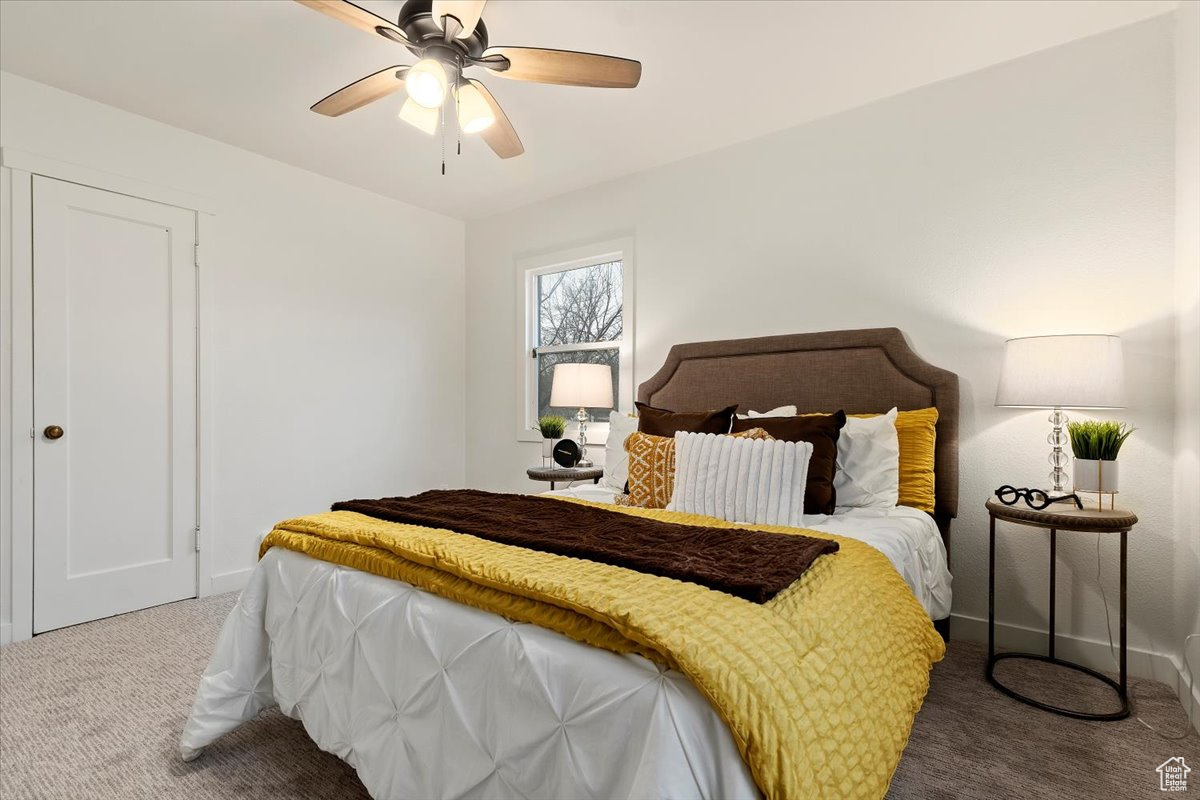 Bedroom featuring carpet floors and ceiling fan