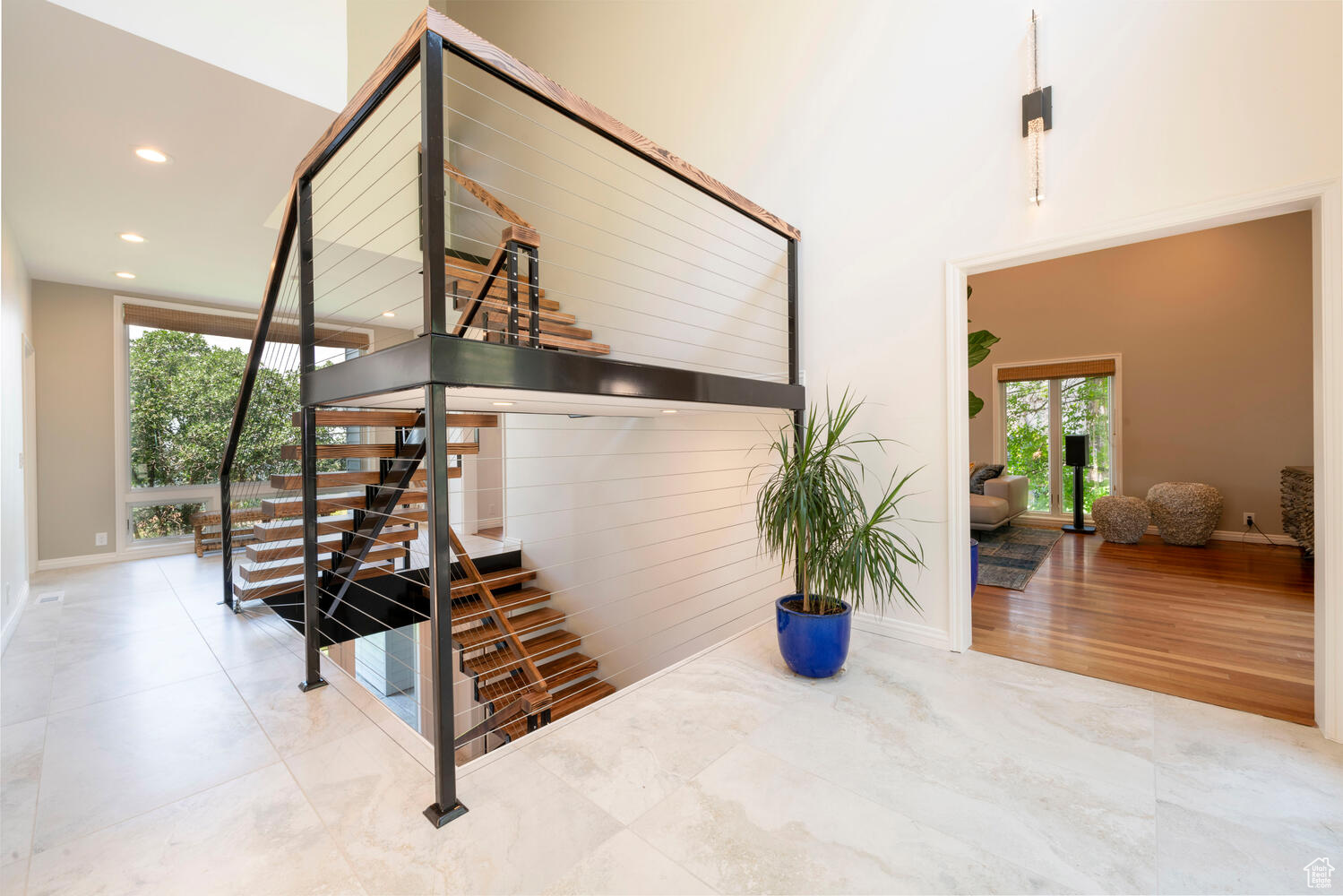 Stairway featuring custom wood flooring