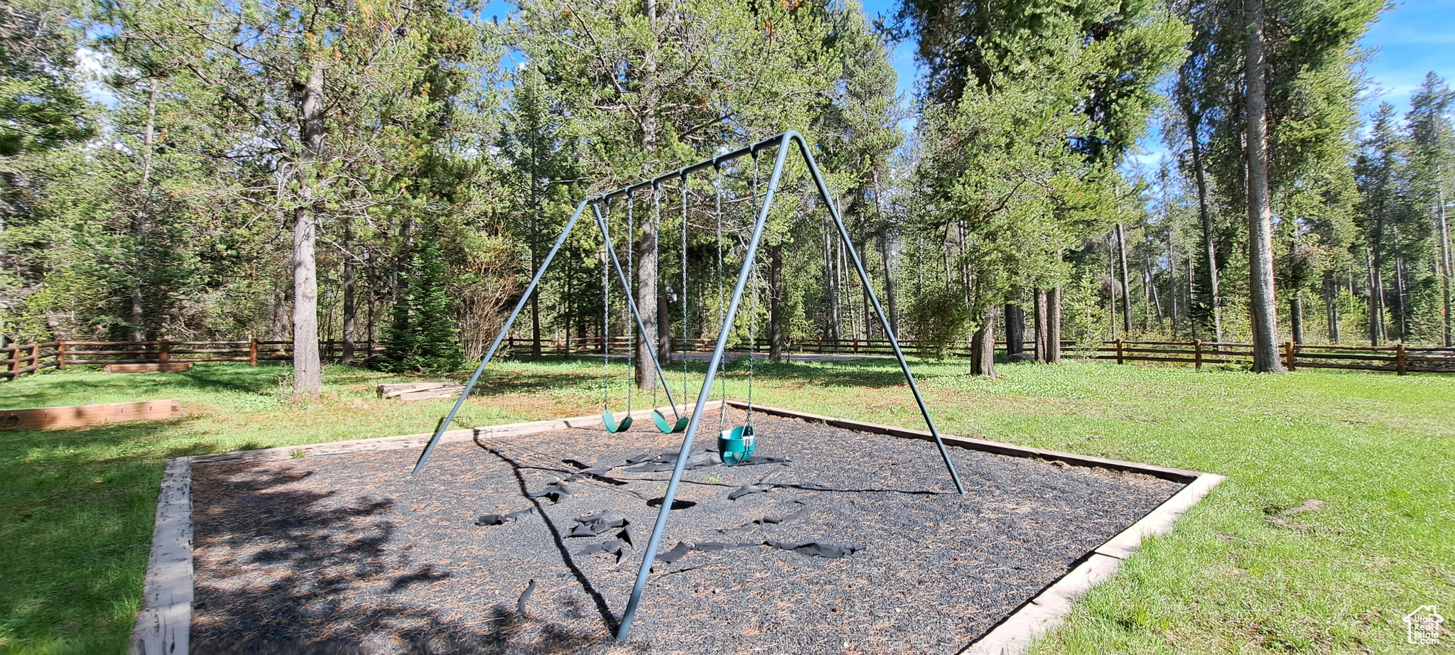 View of jungle gym with a lawn