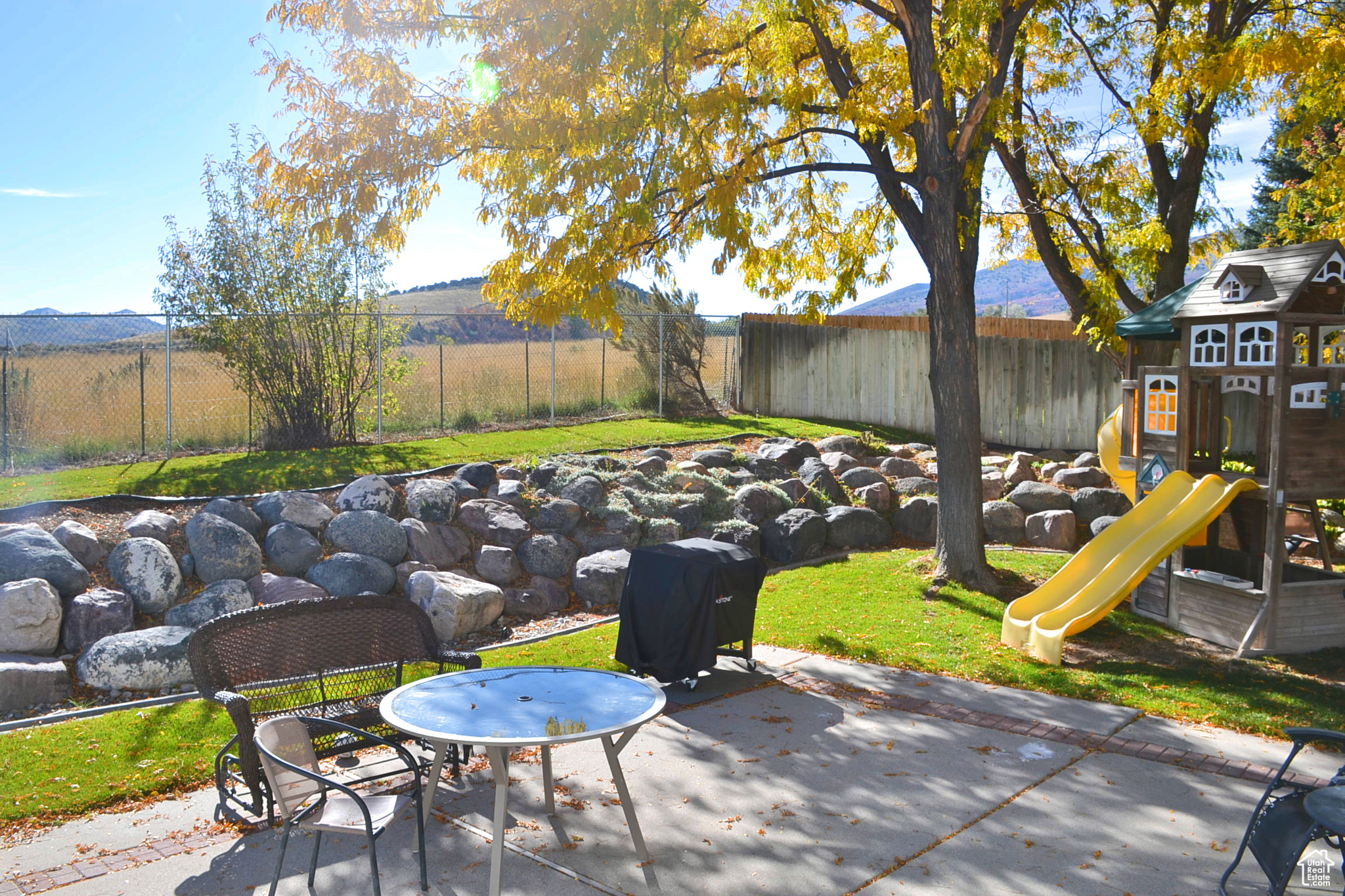 View of patio / terrace with a playground and a mountain view