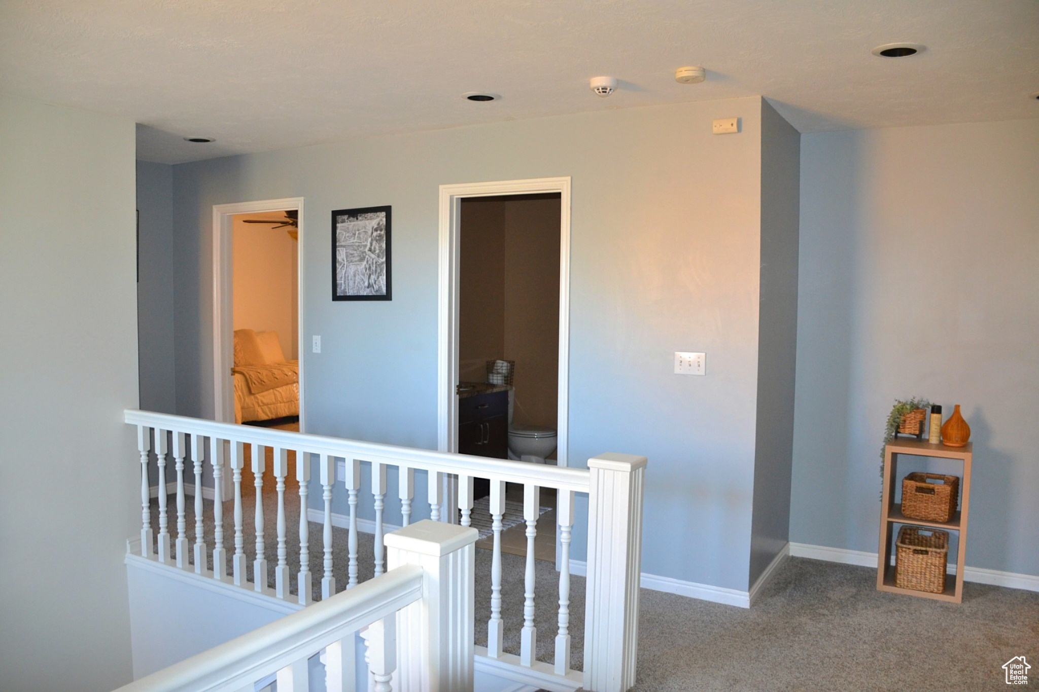 Hall with dark colored carpet