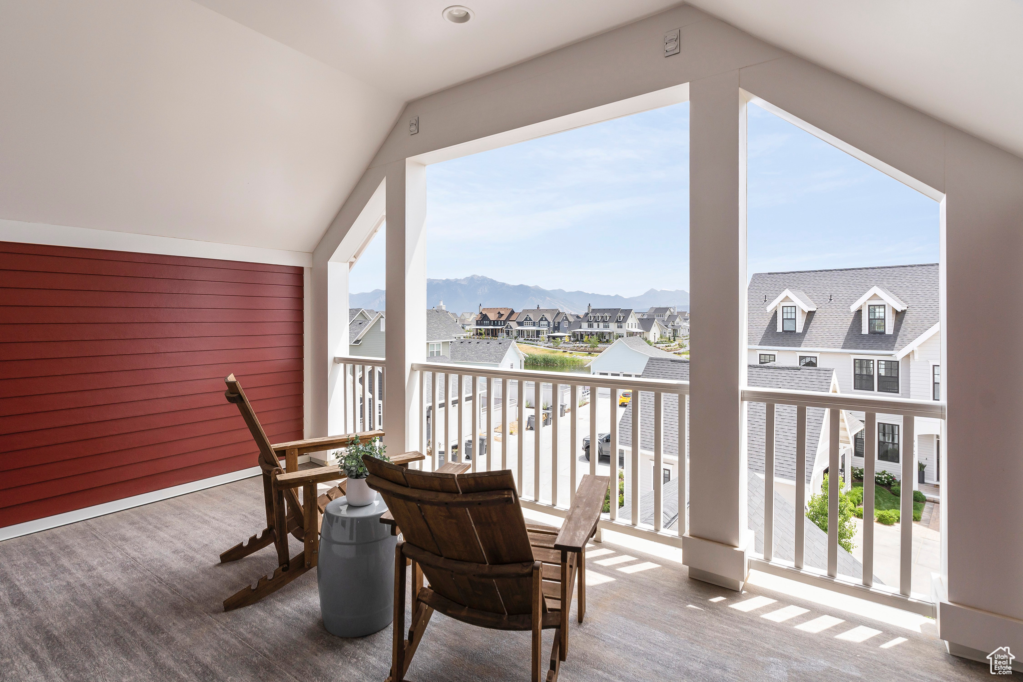Loft deck featuring mountain and views of Oquirrh Lake