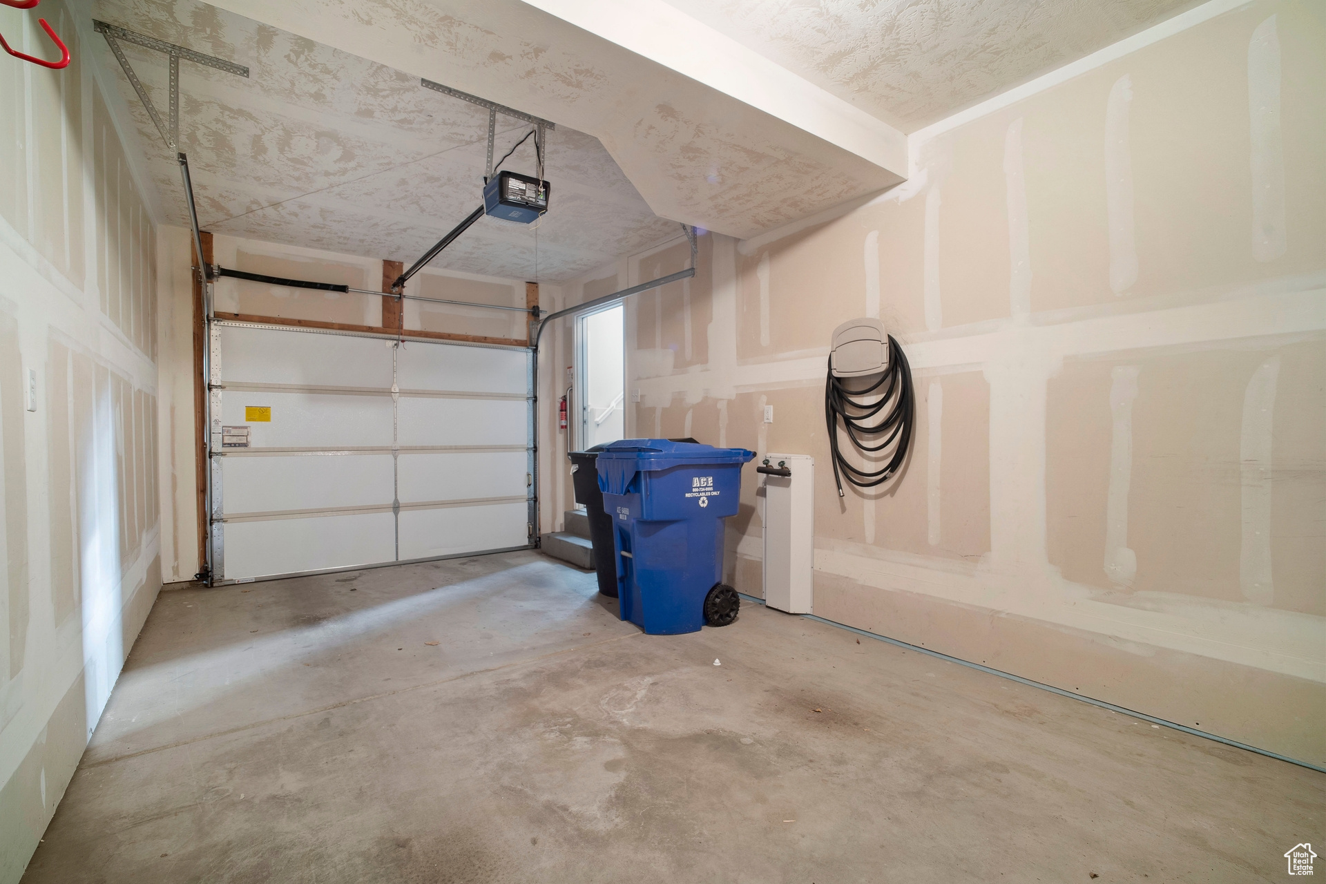 Tandem garage with water spigot, smart design garage door opener.