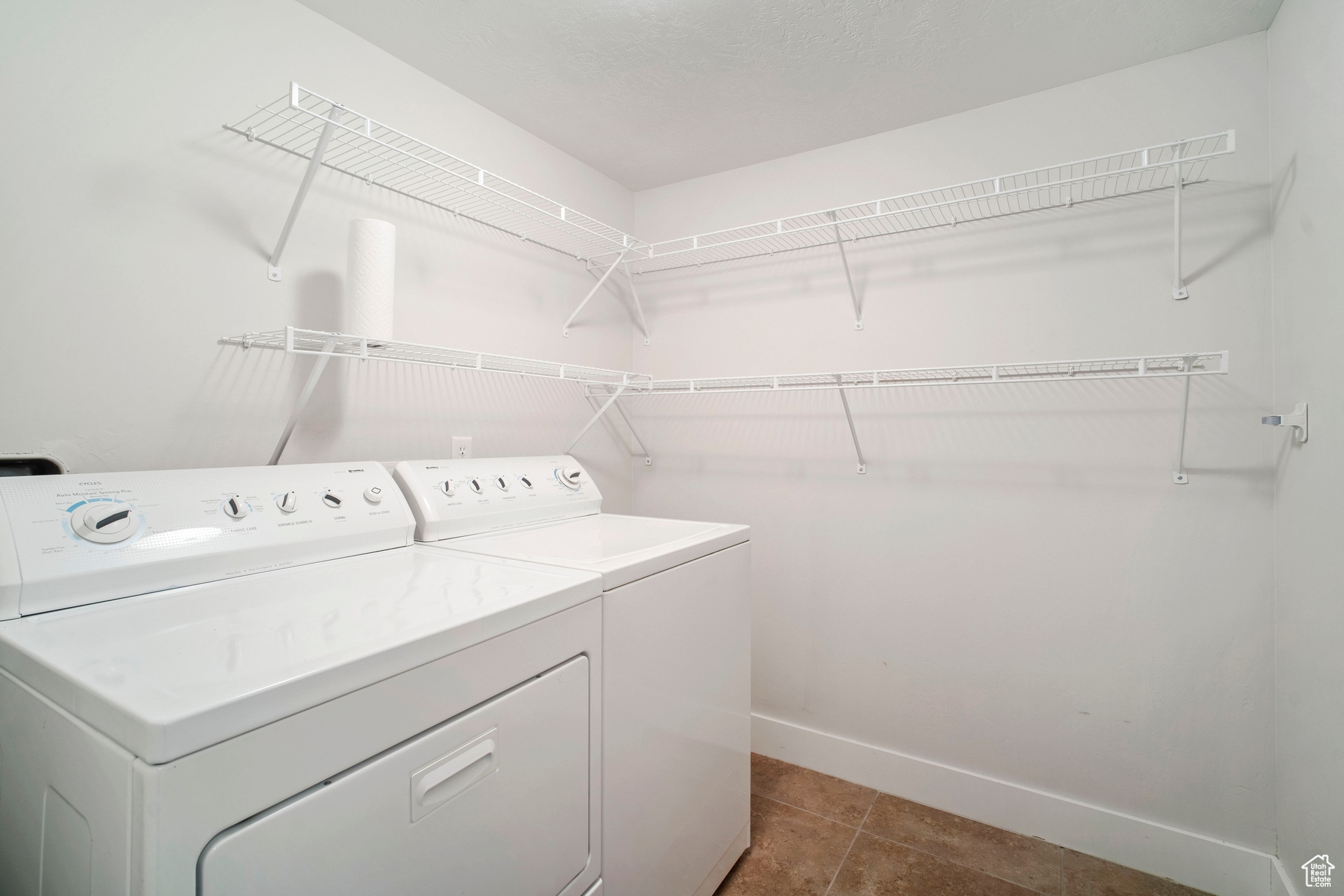 Features plenty of shelving for storage, washer and dryer are included.
