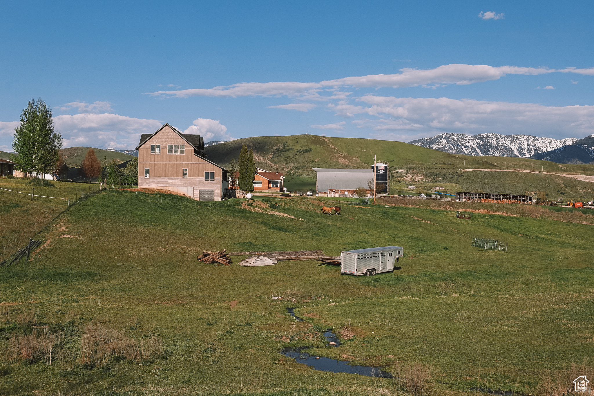 View of front of property featuring a mountain view and a rural view