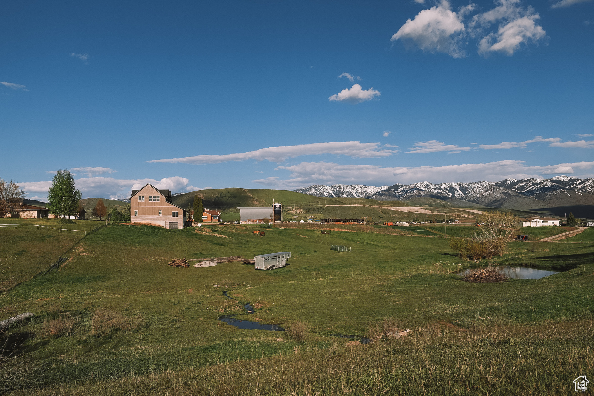 View of mountain feature with a rural view and a water view