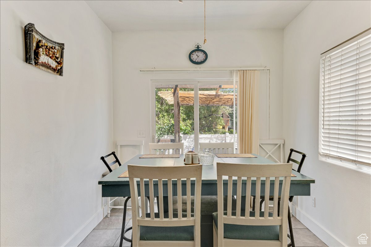 Dining room featuring light tile floors