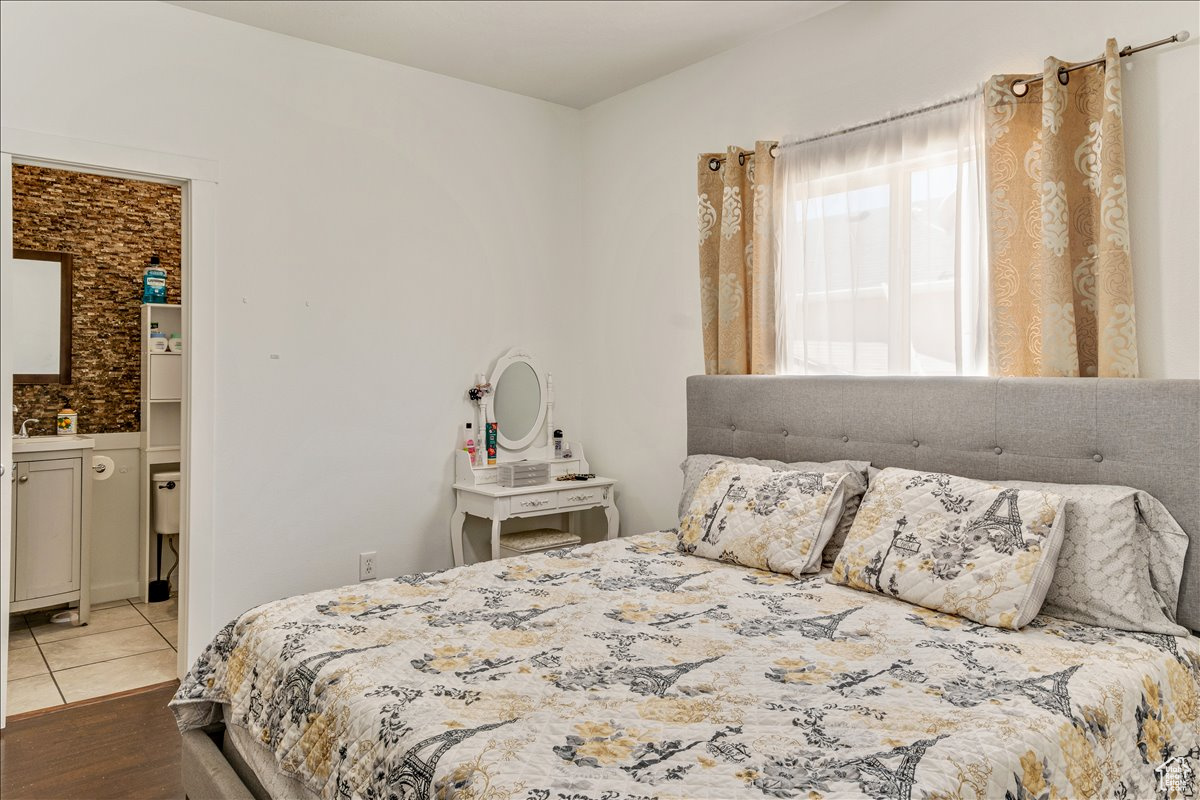 Bedroom with light tile floors